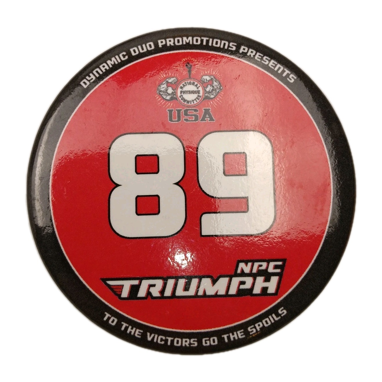 Vintage USA 1989 NPC Triumph Bodybuilding 3" Pin "TO THE VICTORS GO THE SPOILS"