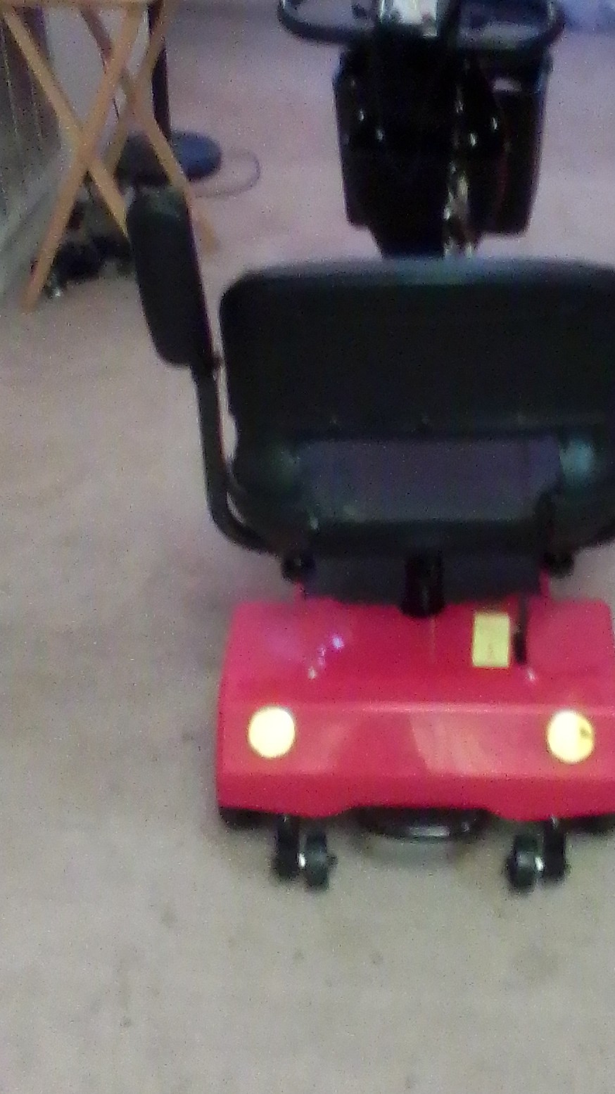 Red 4-Wheeled Mobility Scooter with Basket and Padded Armrest