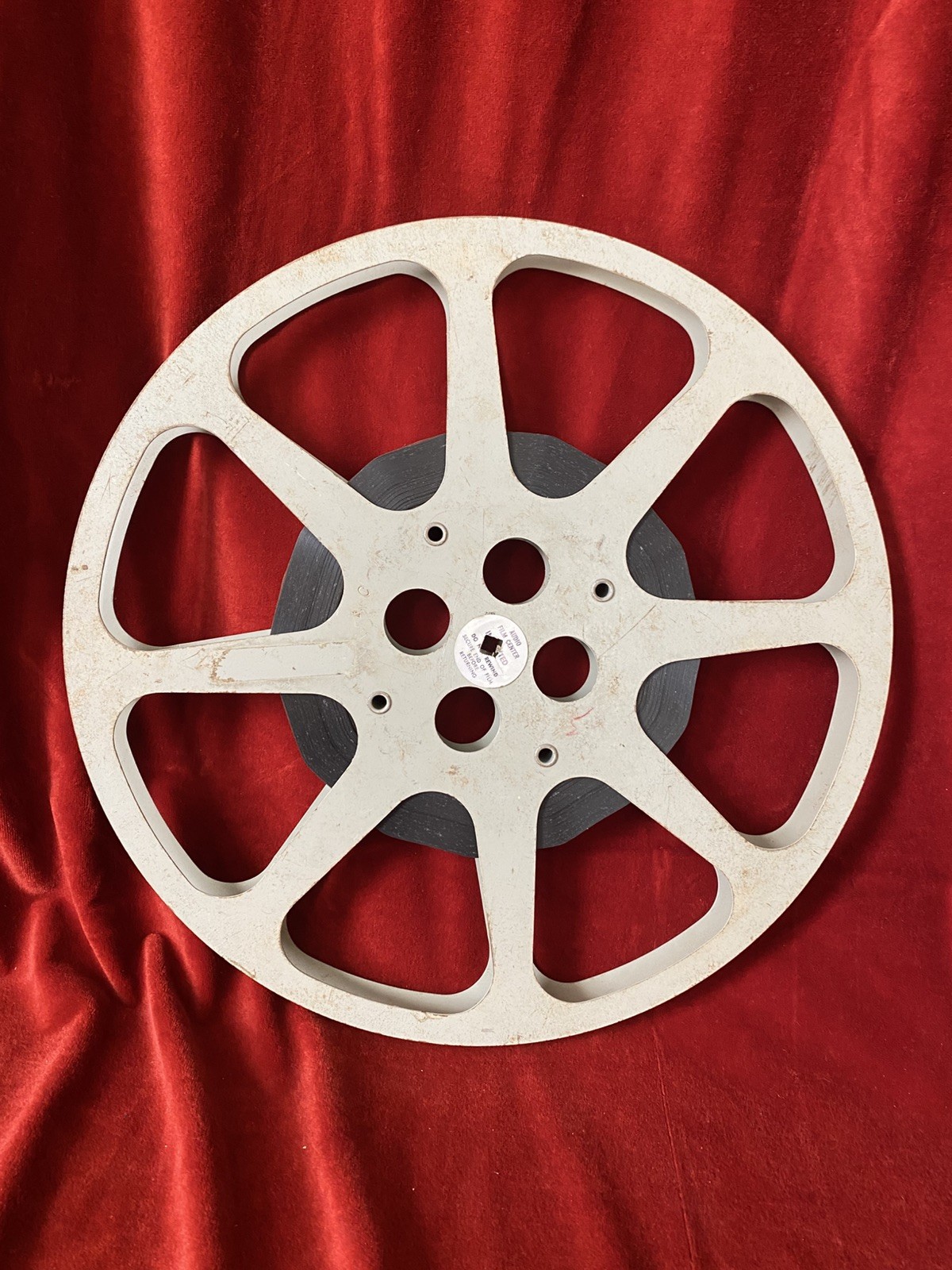 1600 ft Metal Moving Picture Reel 13 3/4”  With a piece of an unknown film