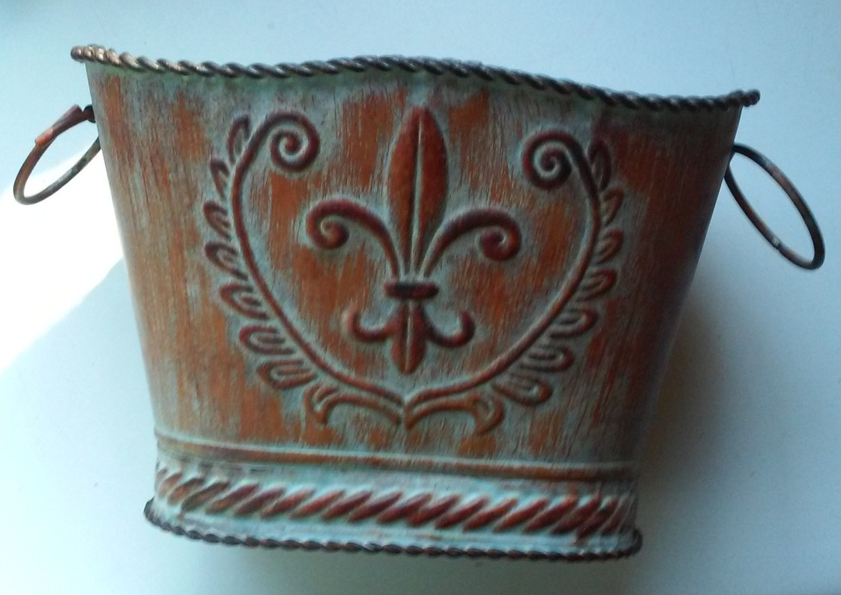 Ornate metal planter with design. Handles On Sides 8 1/2" Across 5 1/2" High 5"