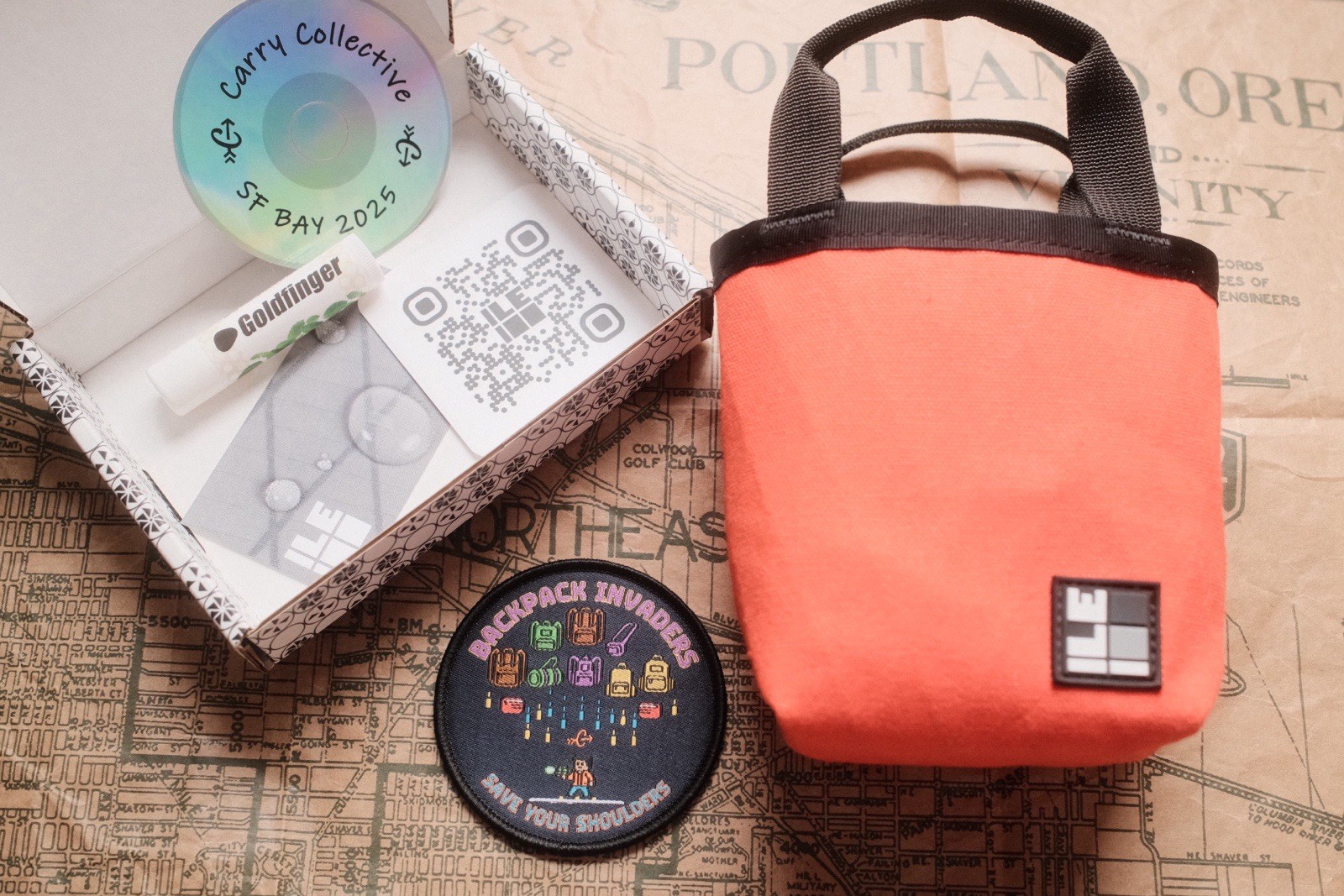 Carryology Backpack Invaders Patch, ILE Bag, and San Francisco Meetup Goodies