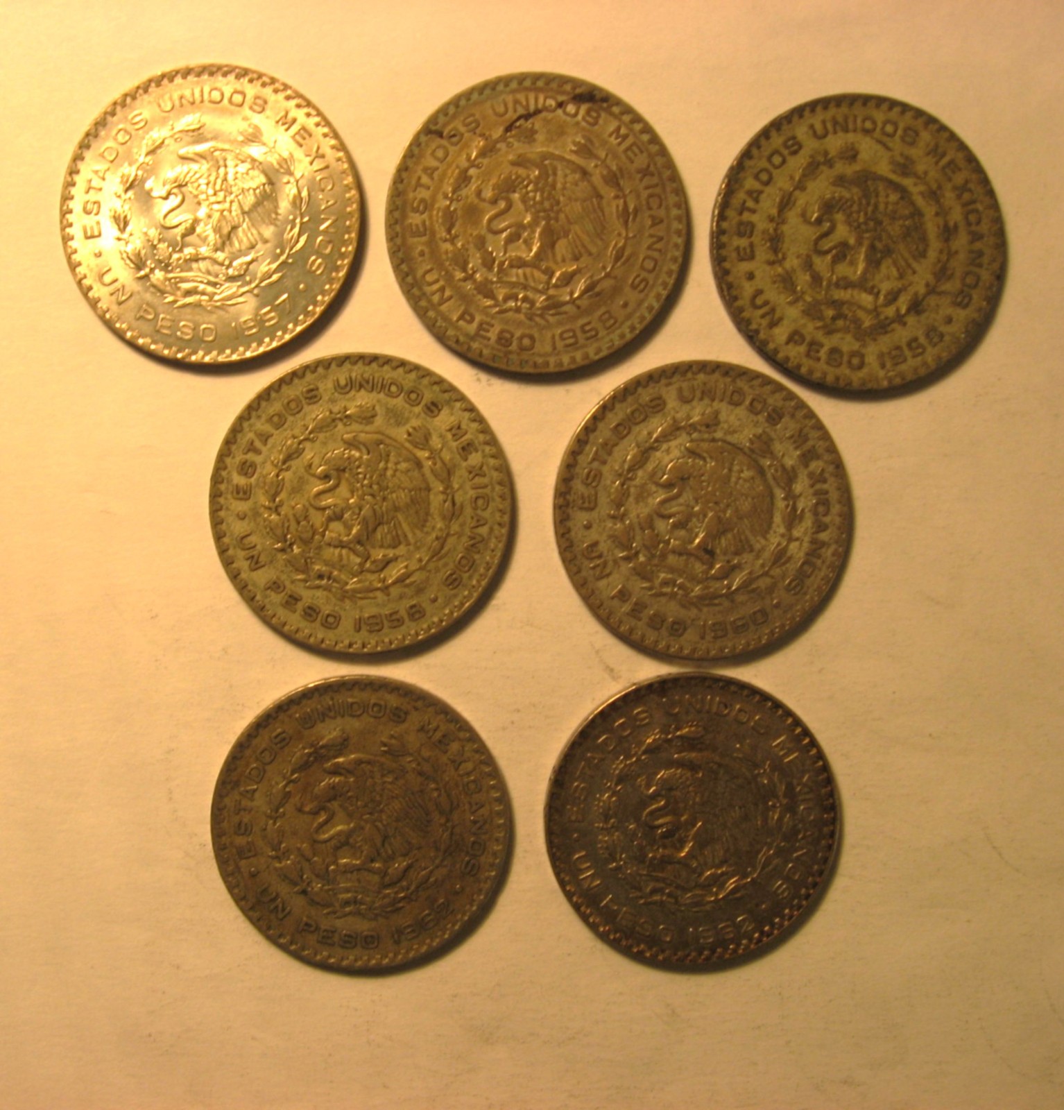 Lot of seven 1957-1962 circulated Mexican one-peso Jose Morales 10% Ag content