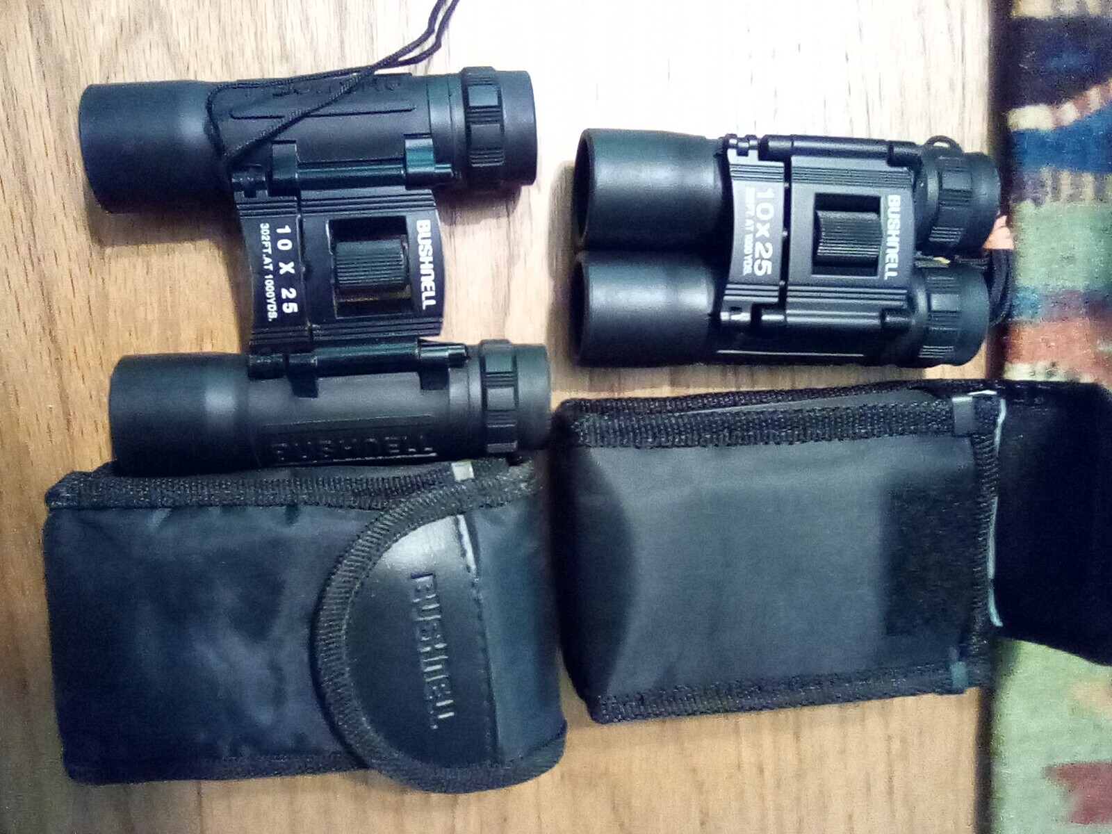 Bushnell 10x25 compact folding binoculars - 2 pair sold together, easy to carry.
