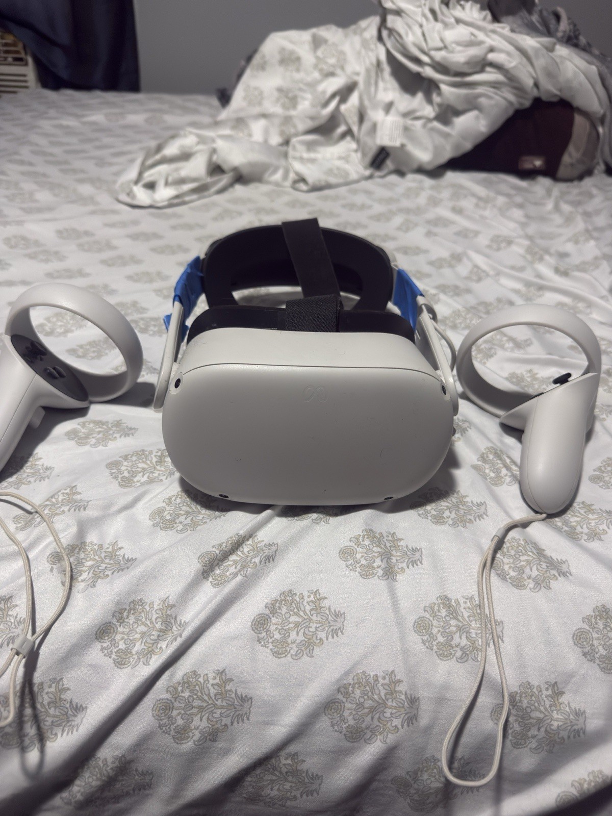 Meta Quest 2 Standalone VR Headset with Touch Controllers. It has a battery pack