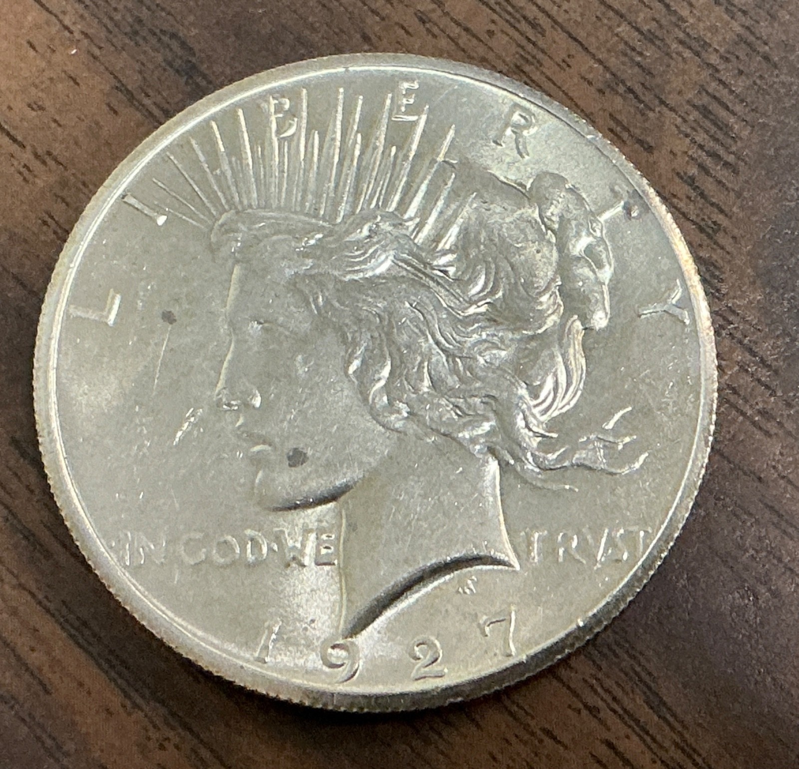 1927 - $1 Peace Silver Dollar - AU/UNC.