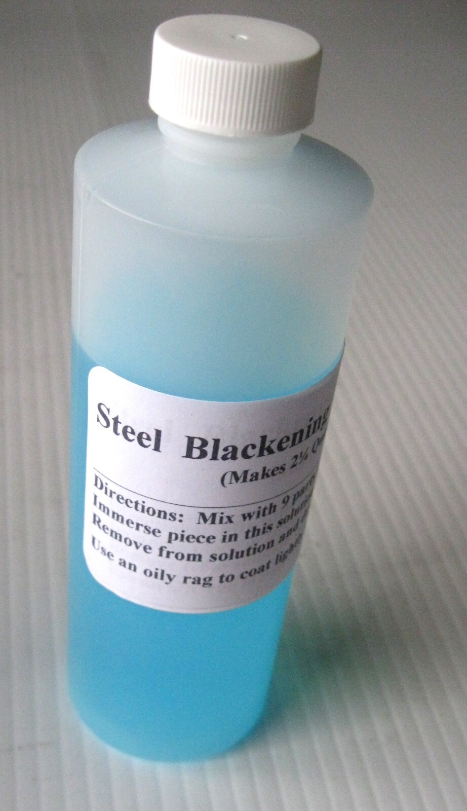 7 oz  steel blackening concentrate, makes 1/2 gallon gun blue / black