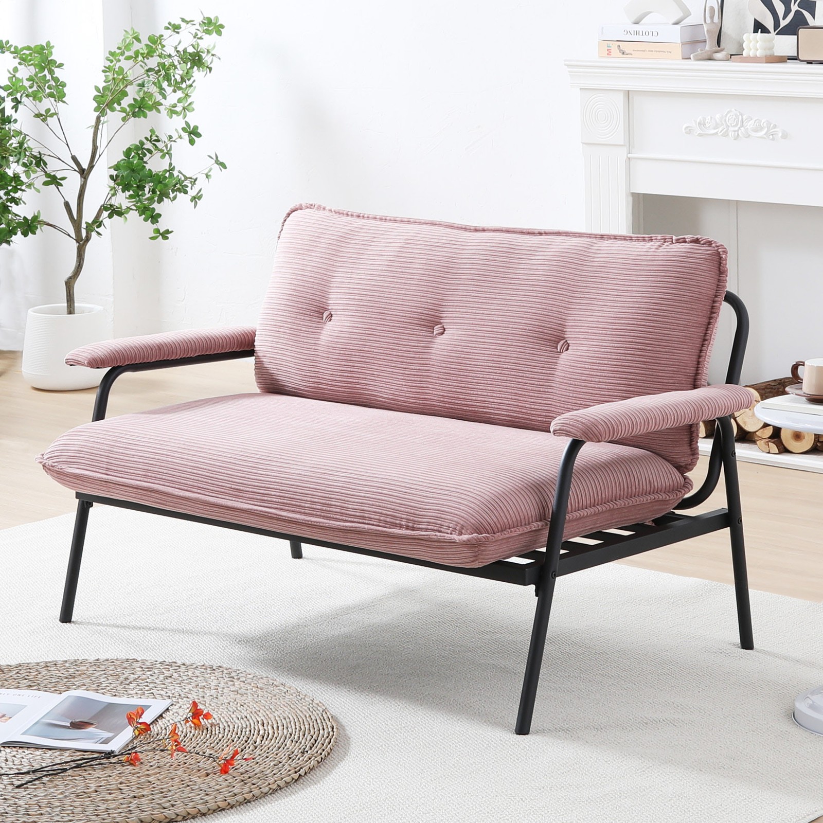 The 53-inch pink sofa offers a spacious layout in the small apartment, easily