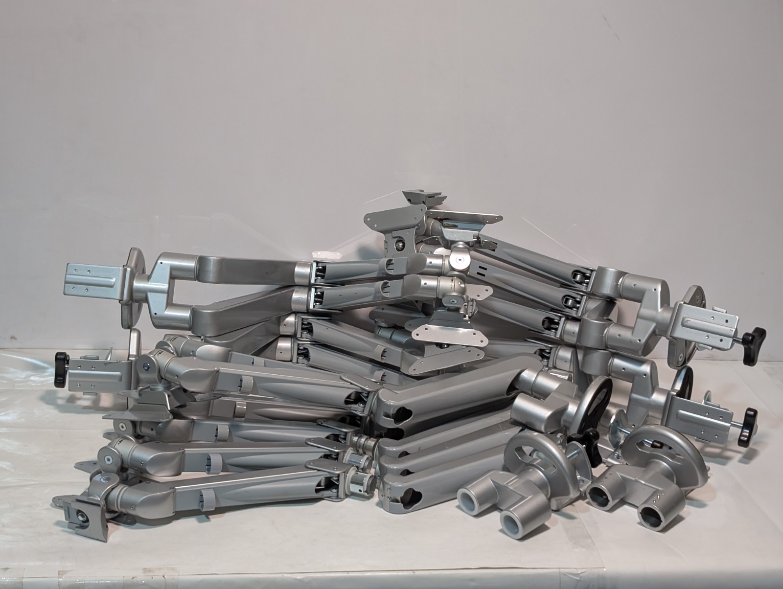 Lot of 7 medical monitor/screen bracket mounts with two arms each as shown