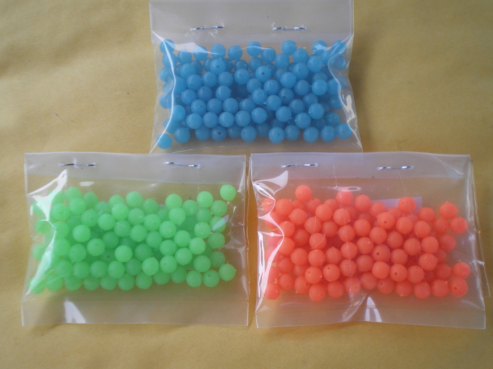 1,500 PCS. 6MM. SOFT/GLOW LURE BEADS-.042 HOLE, BLUE, GREEN, ORANGE 500 PCS. EA.