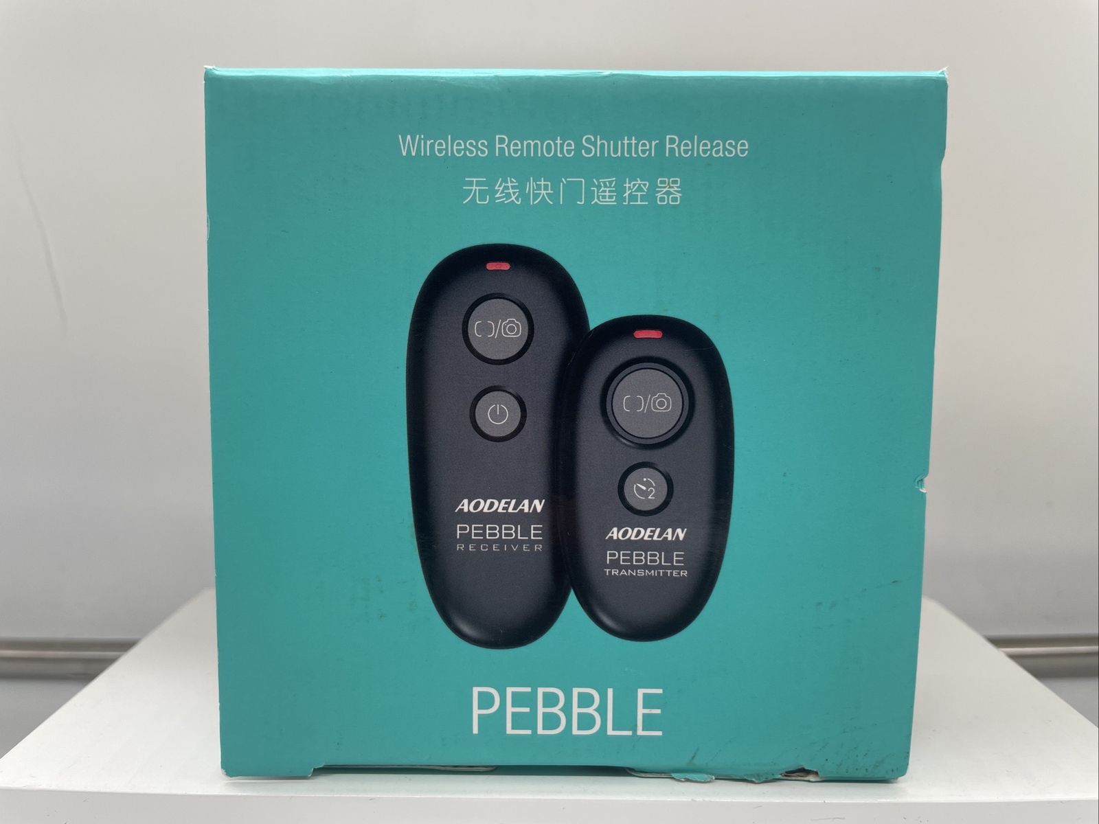 Aodelan Pebble Wireless Shutter Remote Works 80+ Meters. - Open Box - Unused