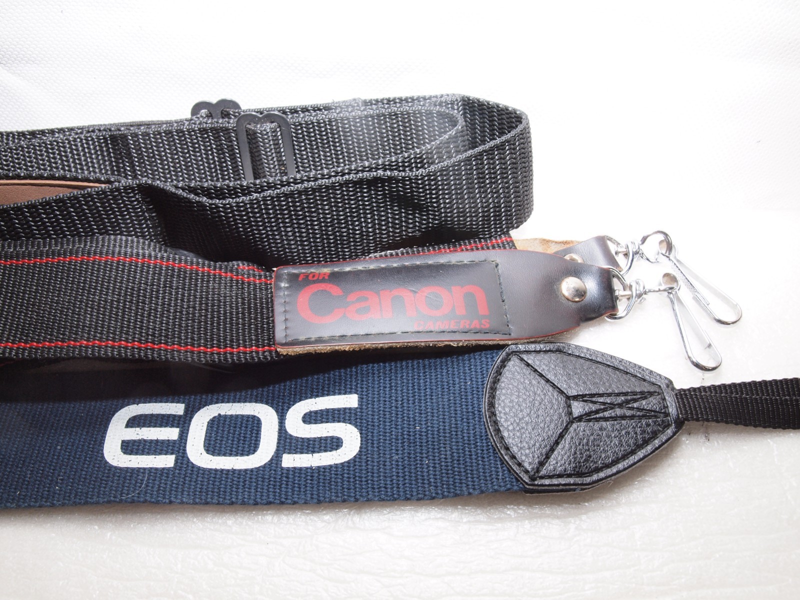 Canon camera straps- 1 new in package includes Canon EOS wide strap.