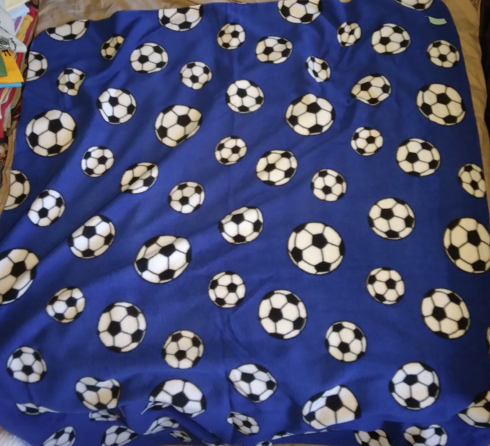 45 X 59 Fleece Throw Soccer Balls on Blue One Layer stitched edge 275590