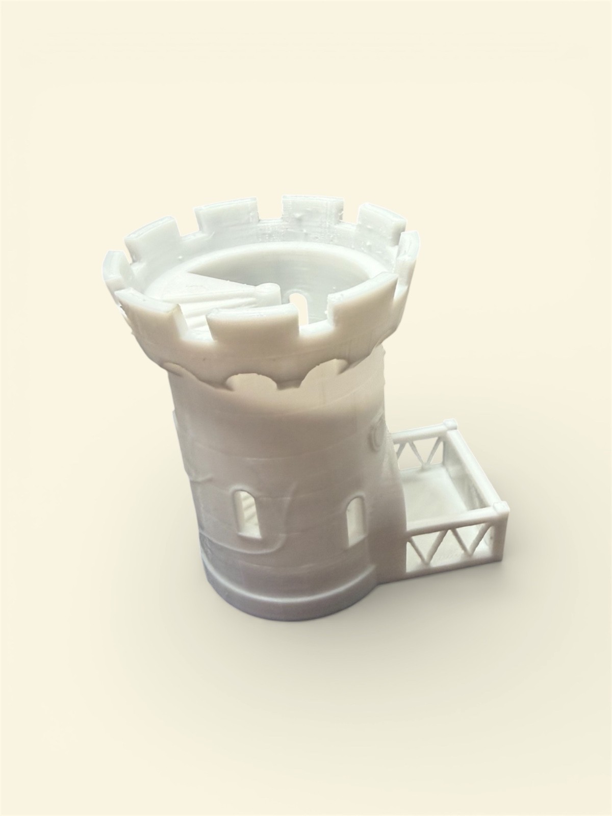 white dice tower with folding gate