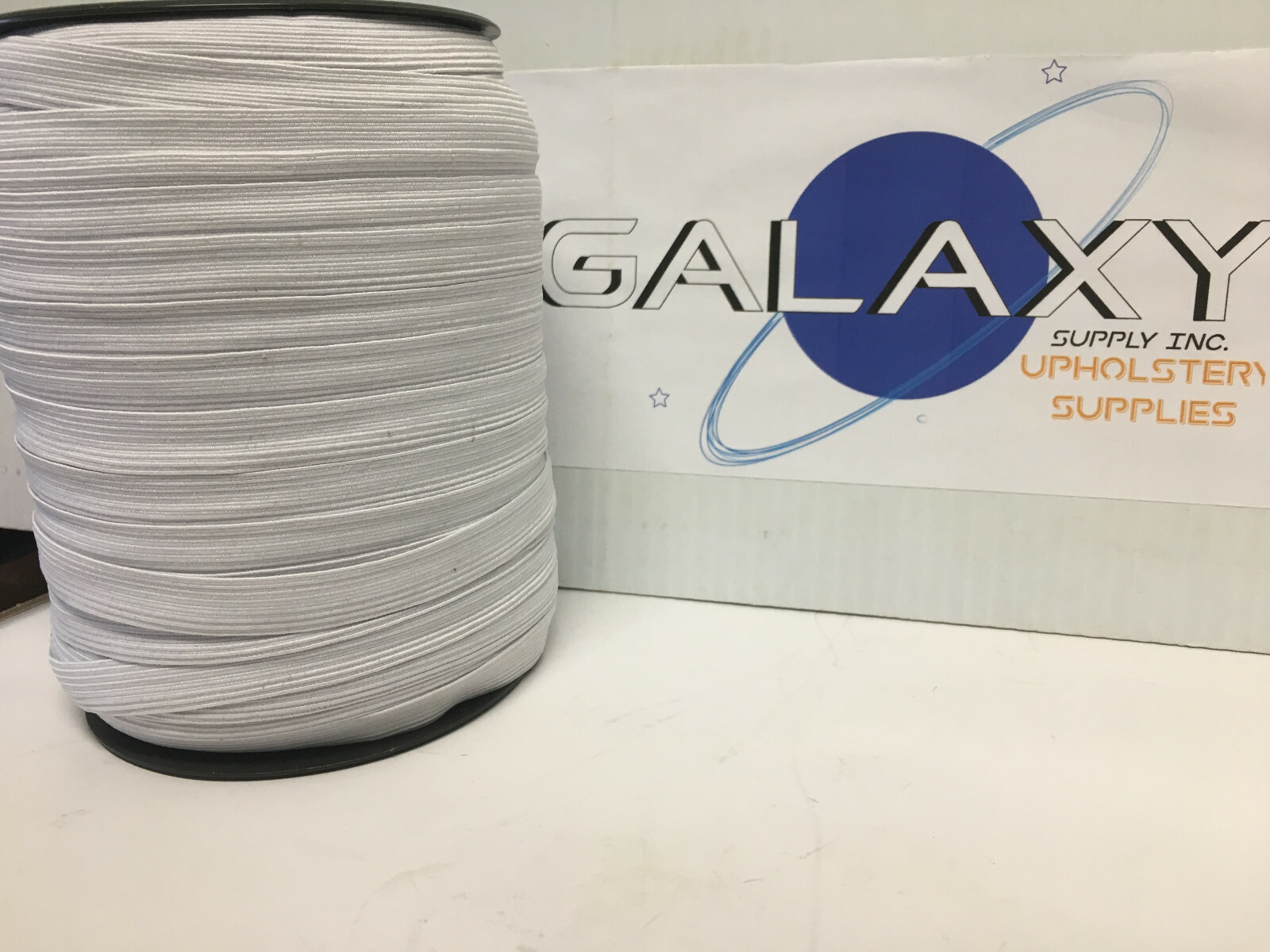 Face Mask Elastic White Webbing ,   1/2" X 150Y / Roll. UPC901010