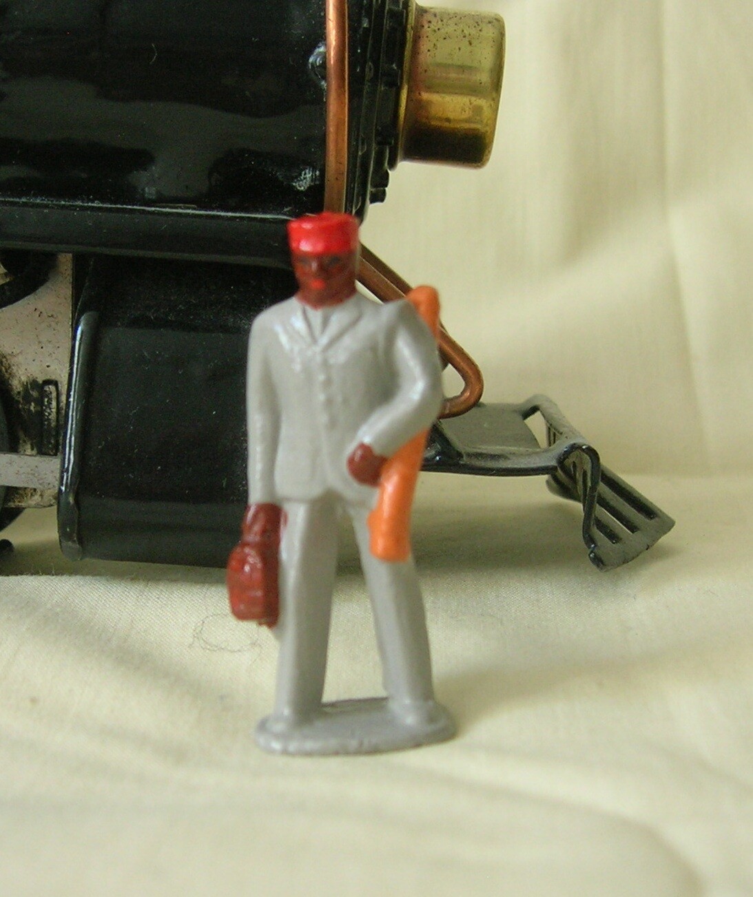 Redcap carrying luggage, O scale model train layout figure, Reproduction