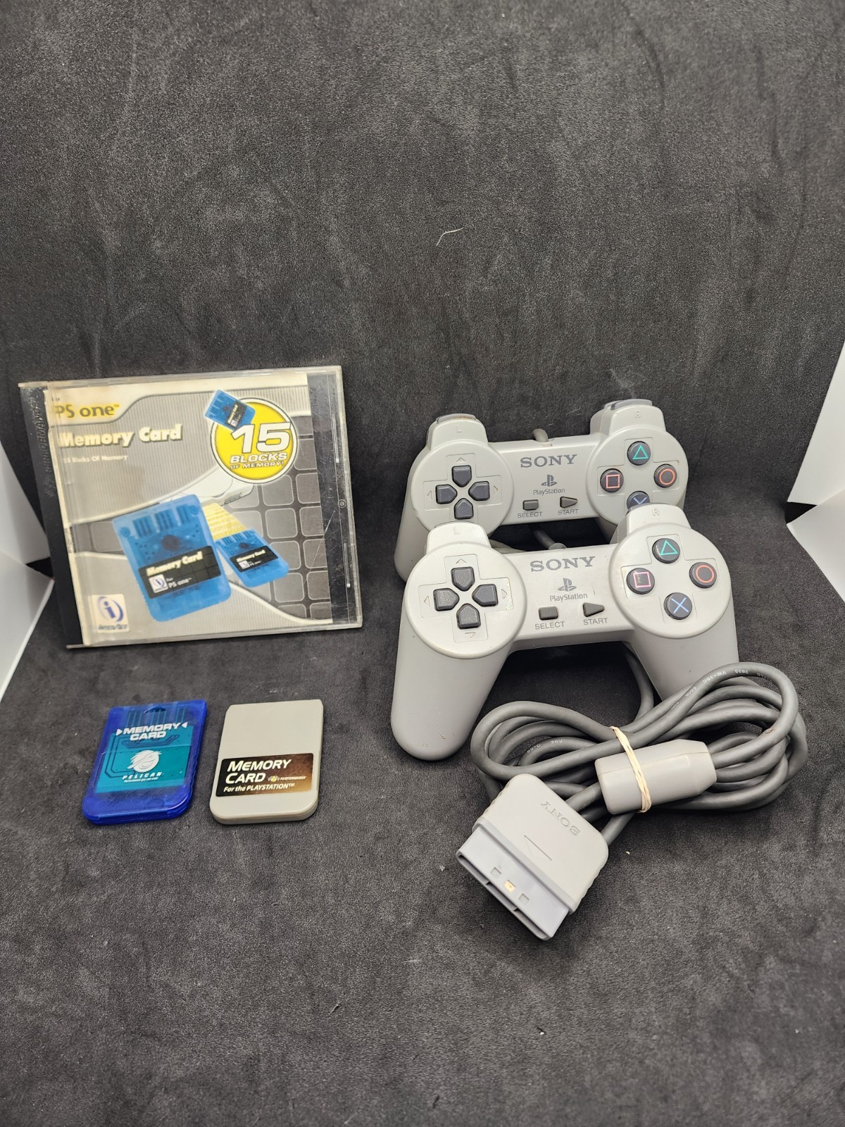 2 Playstation Controllers And 2 Memory Cards