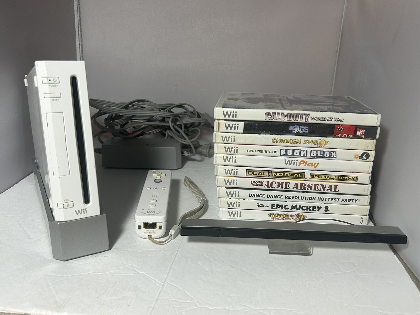 Wii Console and 10 Games, Sensor, Power and AV Cables included - No Top Panel