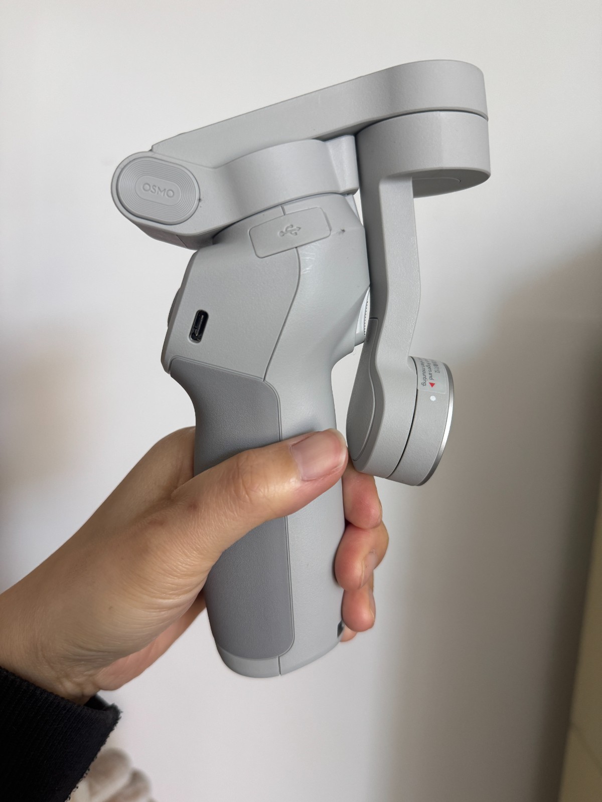 DJI OM 4 smartphone gimbal stabilizer kit.