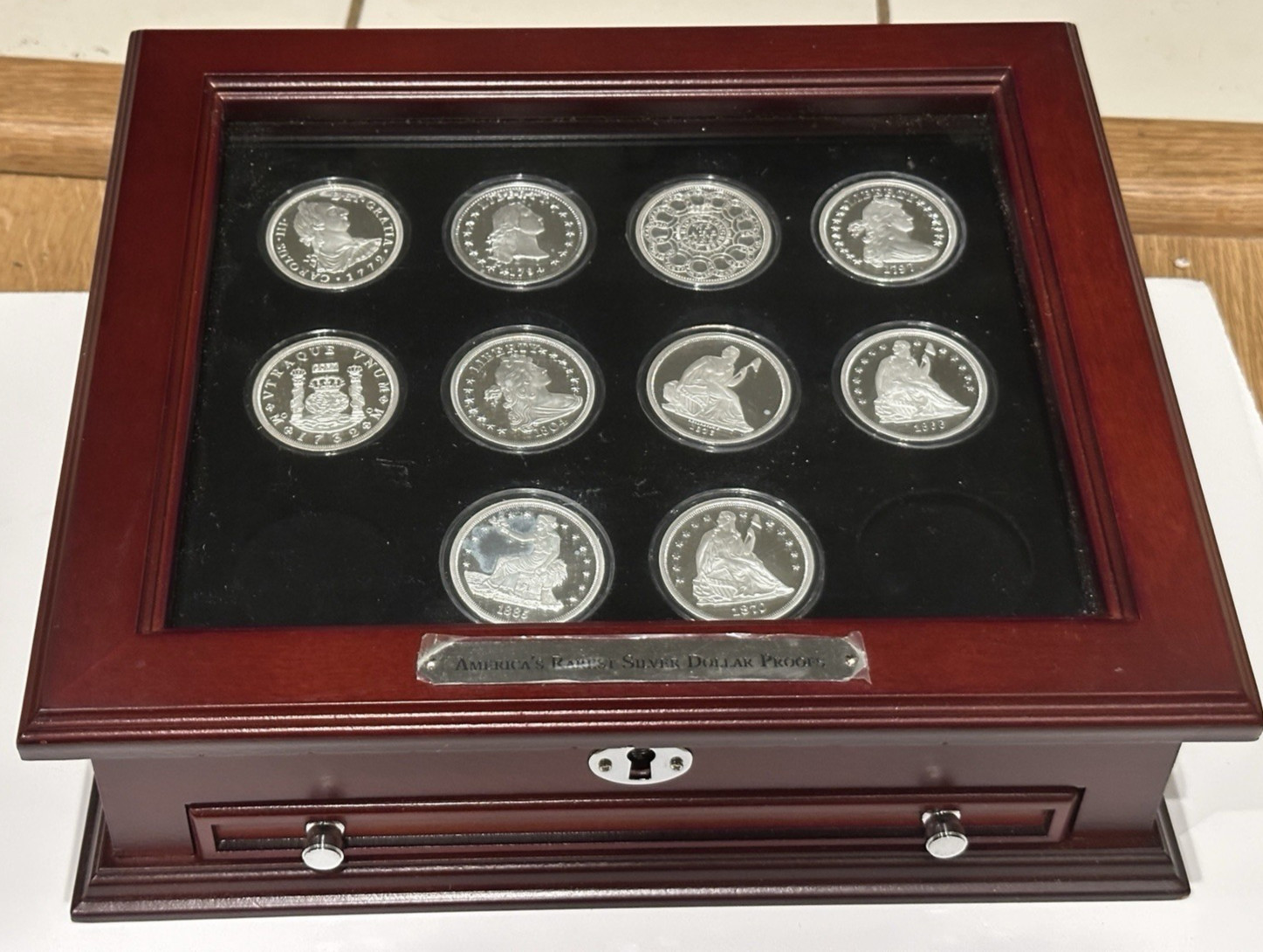 America’s Rarest Silver Dollar Proofs - 10  Copies In Wood Display Box