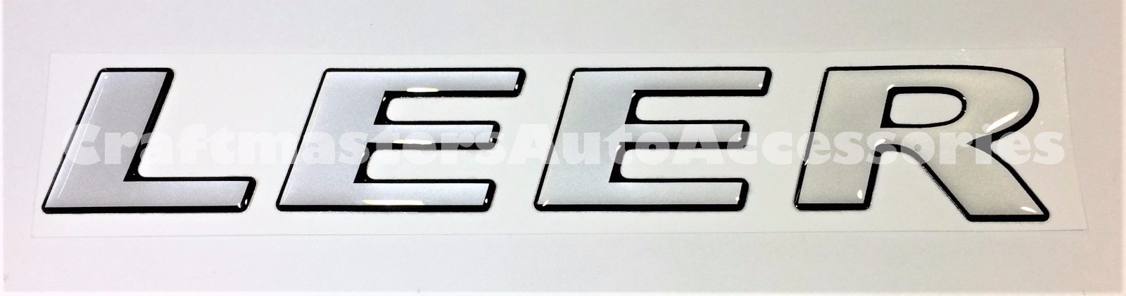 Genuine LEER truck cap rear door emblem #76383 for 100XQ and XL/XR series caps