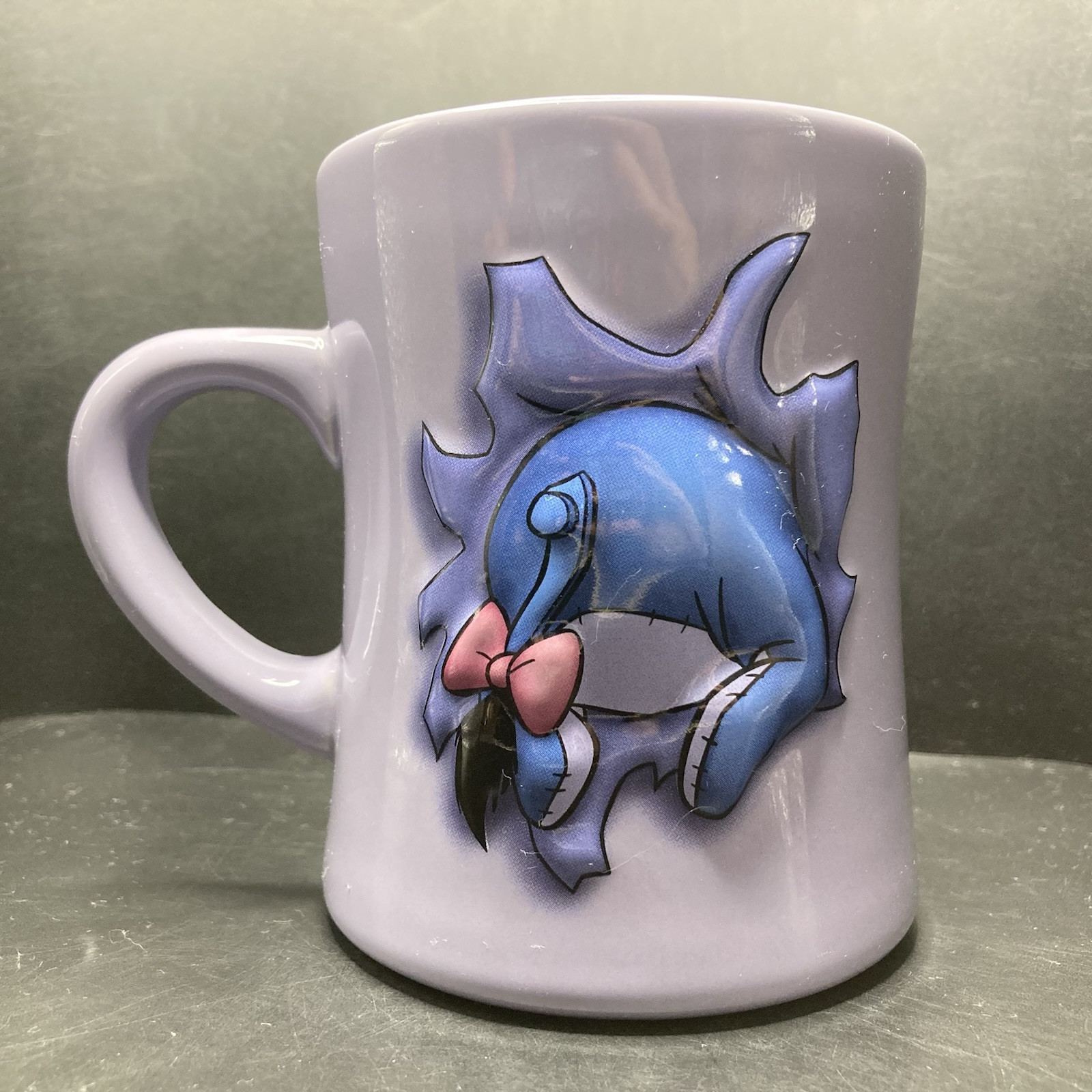 Disney Store Eeyore Bursting Through a Wall LARGE Purple Embossed Ceramic Mug