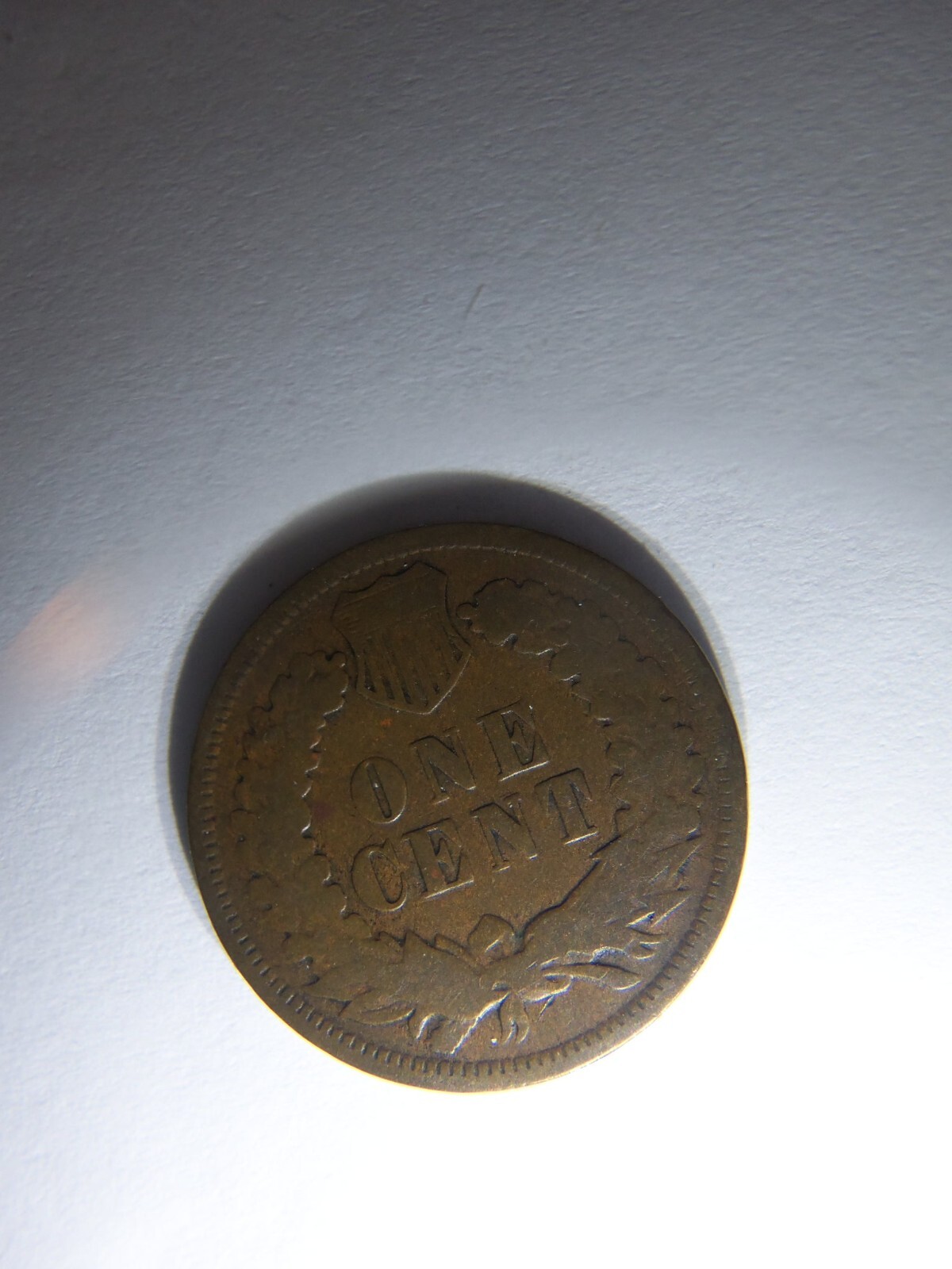 A KEY 1875 INDIAN HEAD PENNY
