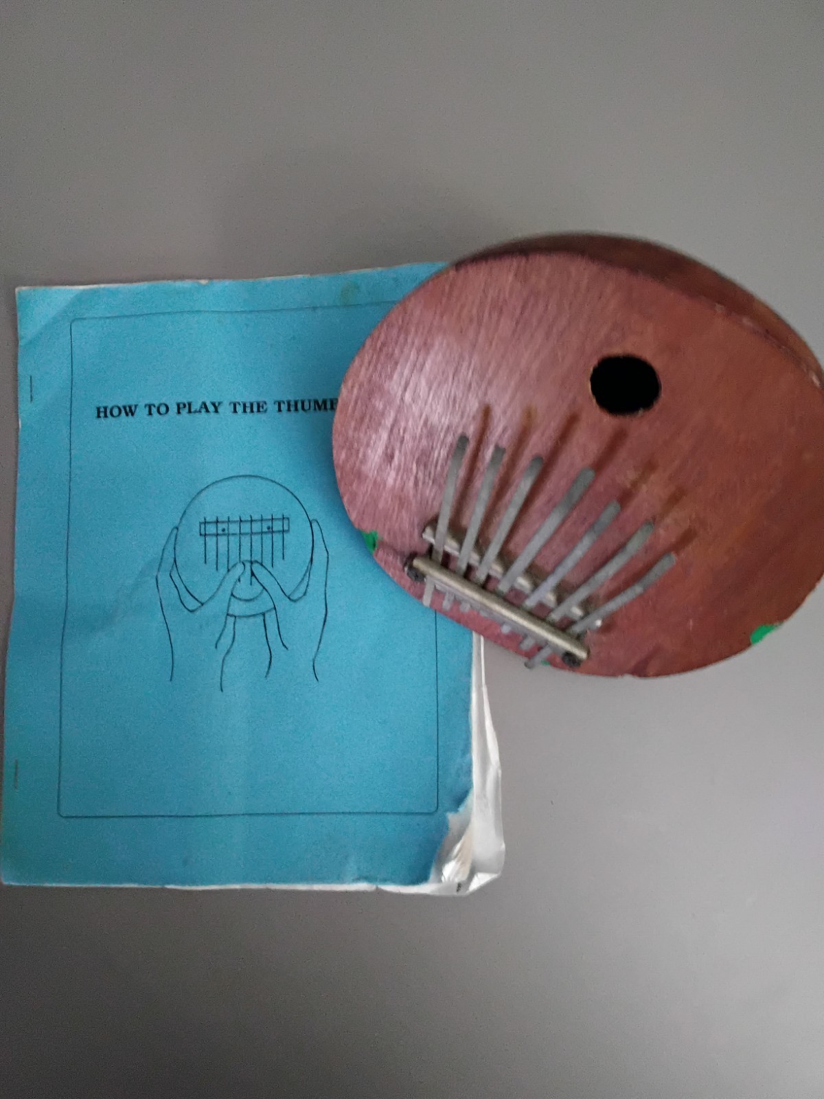 Half Coconut Thumb Piano With Learners Guide.