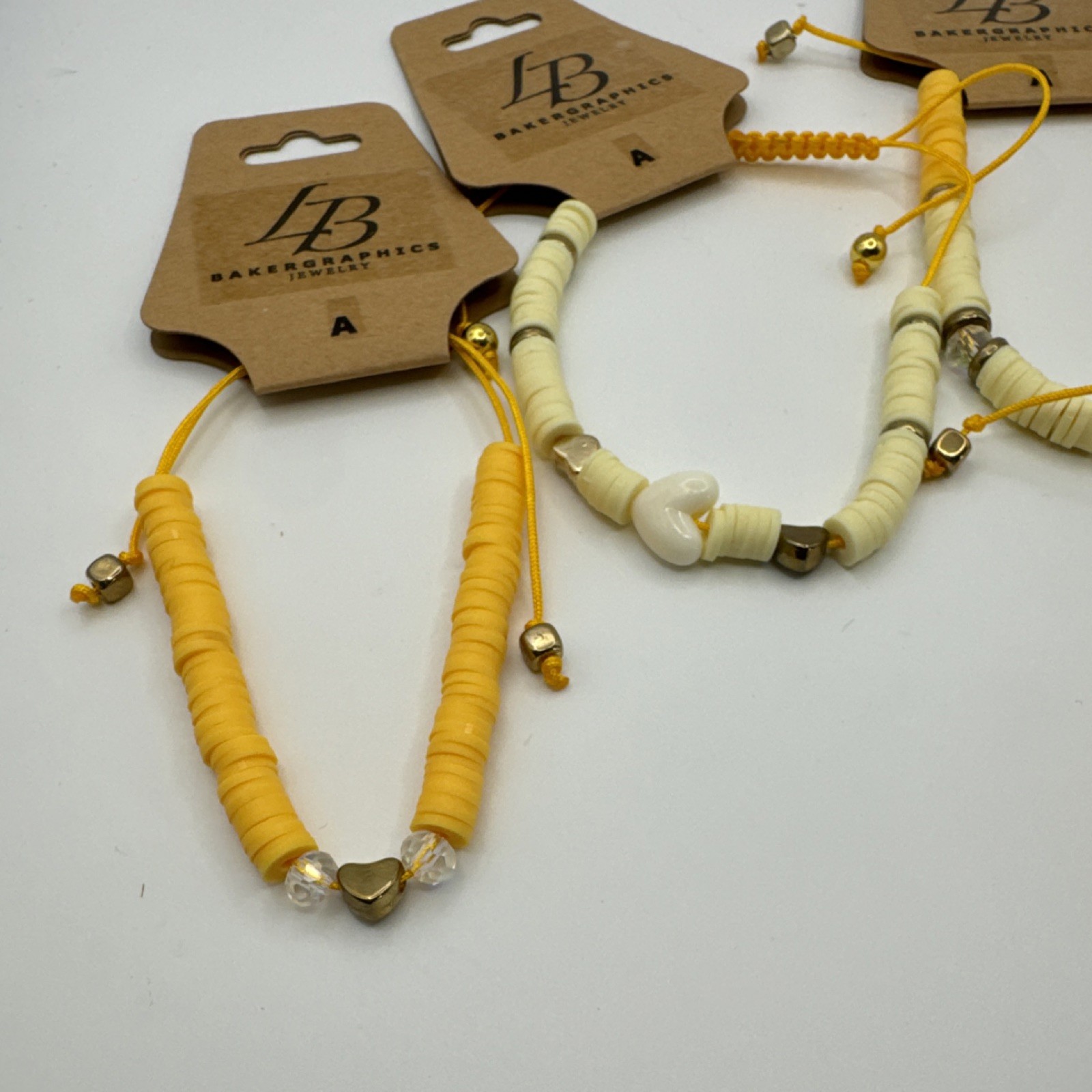 Bakergraphics Jewelry Yellow Cream Beaded Adjustable Charm Bracelets Set
