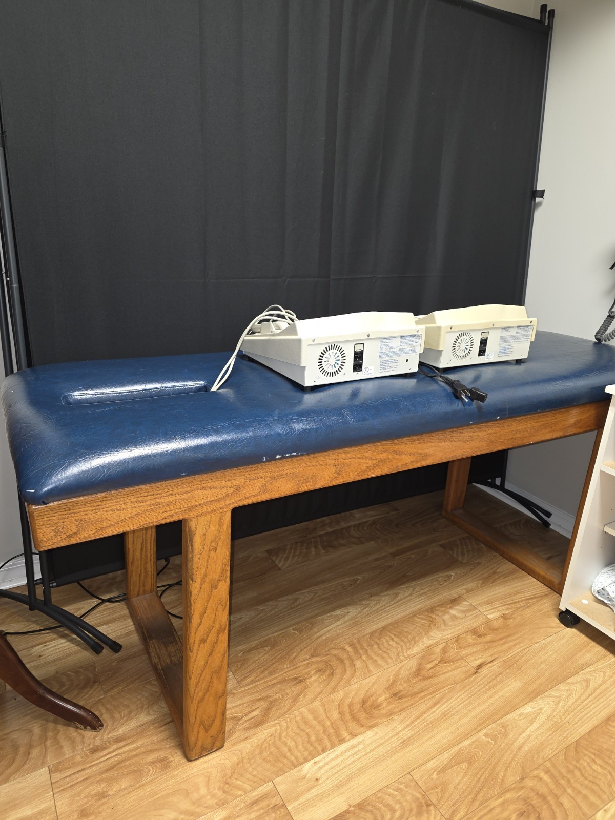 Blue Padded Upholstered Stationary Exam Table with Wood Frame