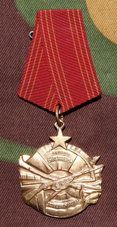 Yugoslav Medal for Merits to the People. Comes with ribbon bar. Numbered
