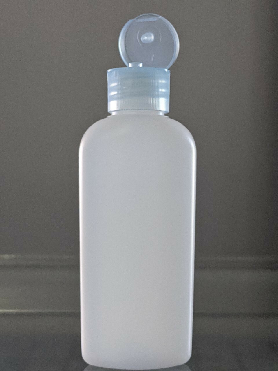 2 oz Classic Oval Bottle Natural HDPE With Dispensing Lid 