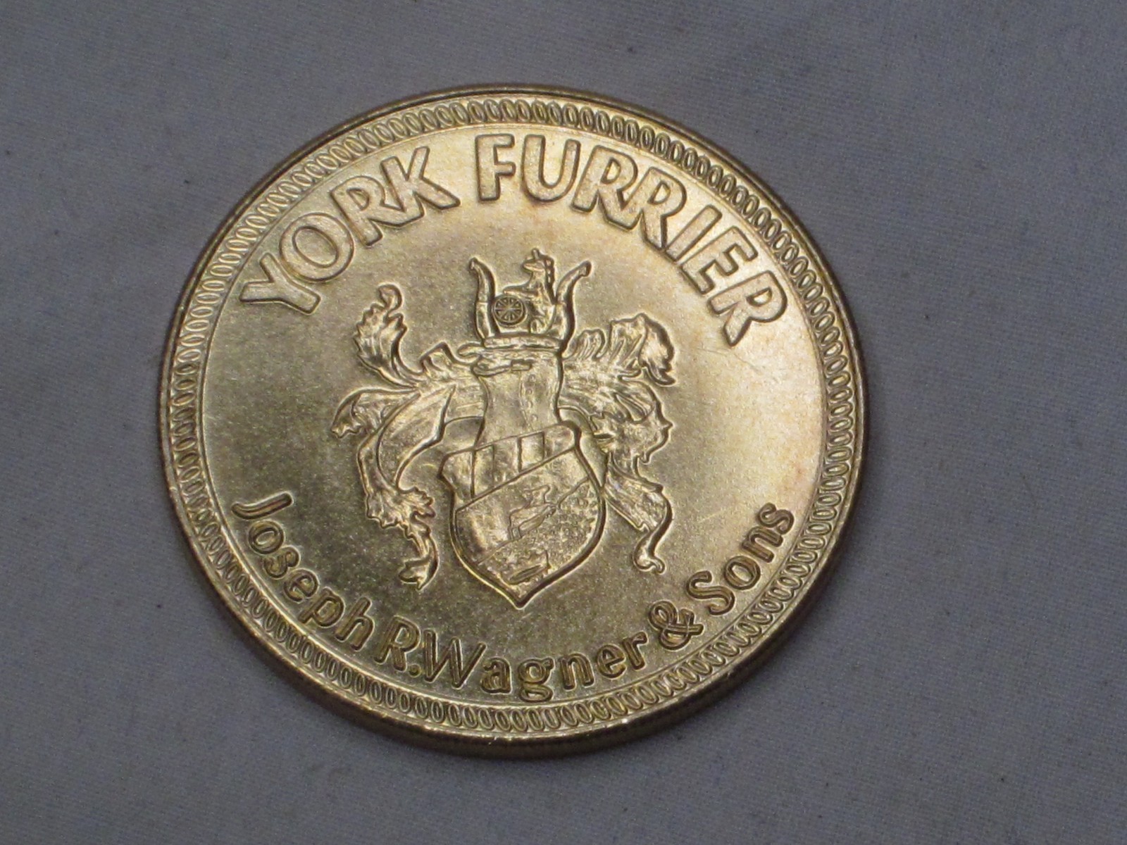 1x YORK FURRIER $1000 ONE THOUSAND DOLLARS Merchandise Coin Wagner & Sons