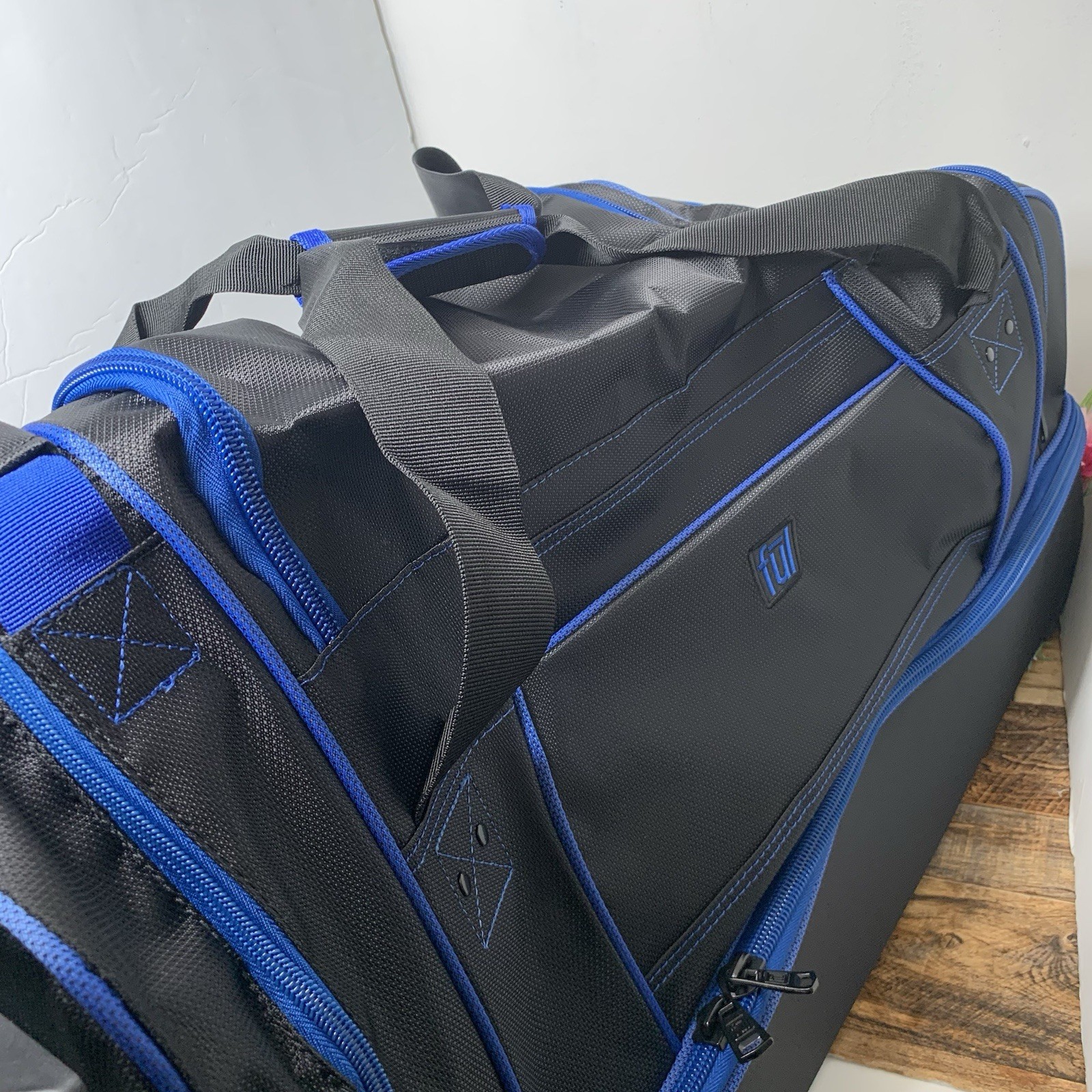FŪL - Full Split Level Rolling Duffle Luggage Bag with Wheels - Black / Blue
