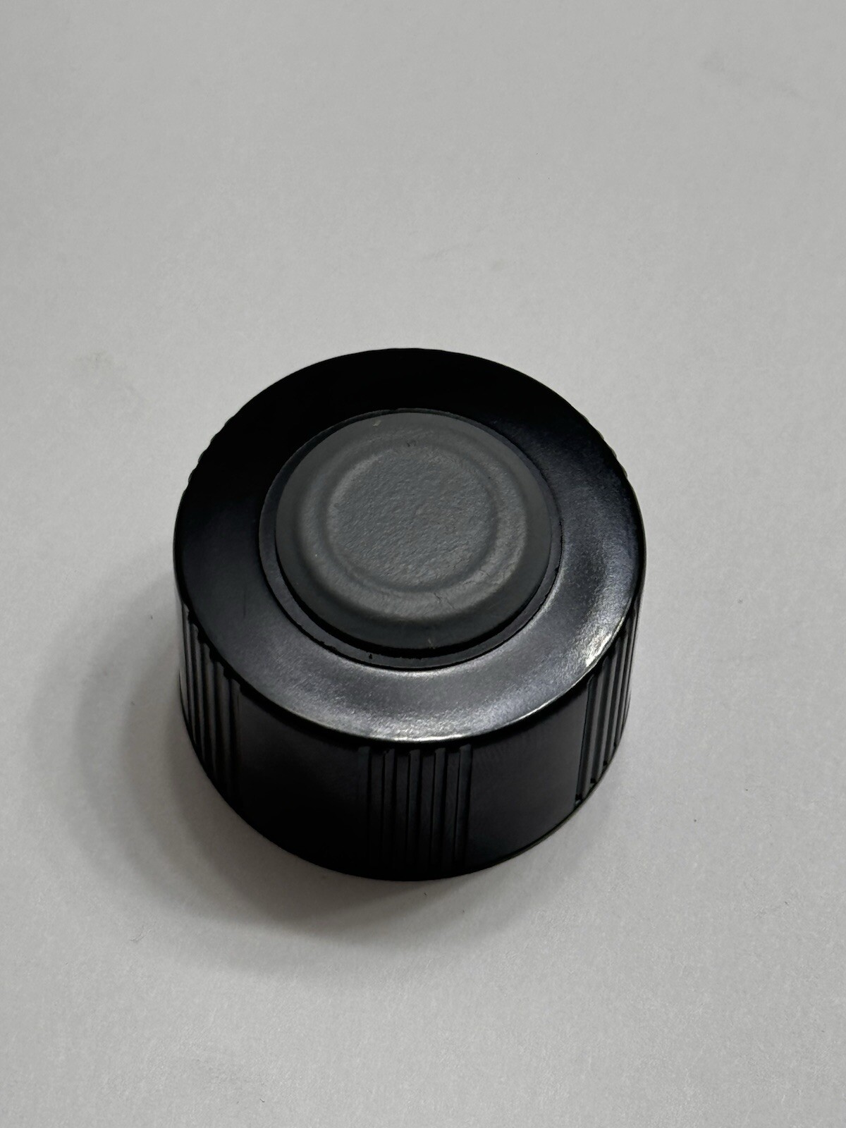 Wheaton Black 33mm phenolic caps with attached 33mm butyl septa.