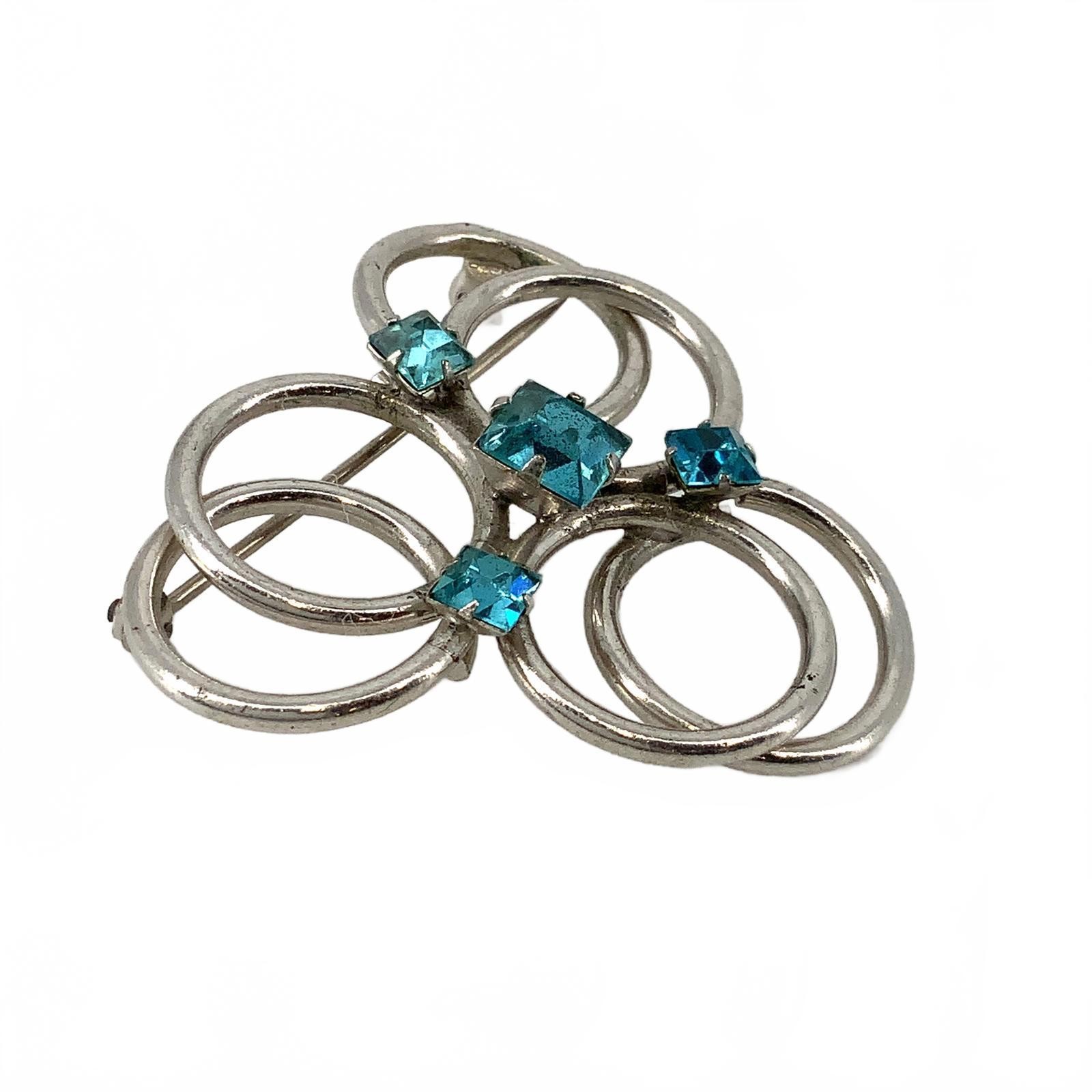 Vintage Silvertone Blue Crystal Mid Century Brooch Interlocking Circle Pin