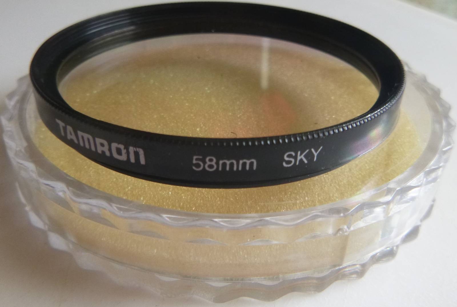 TAMRON 58mm SKY filter with plastic cover.