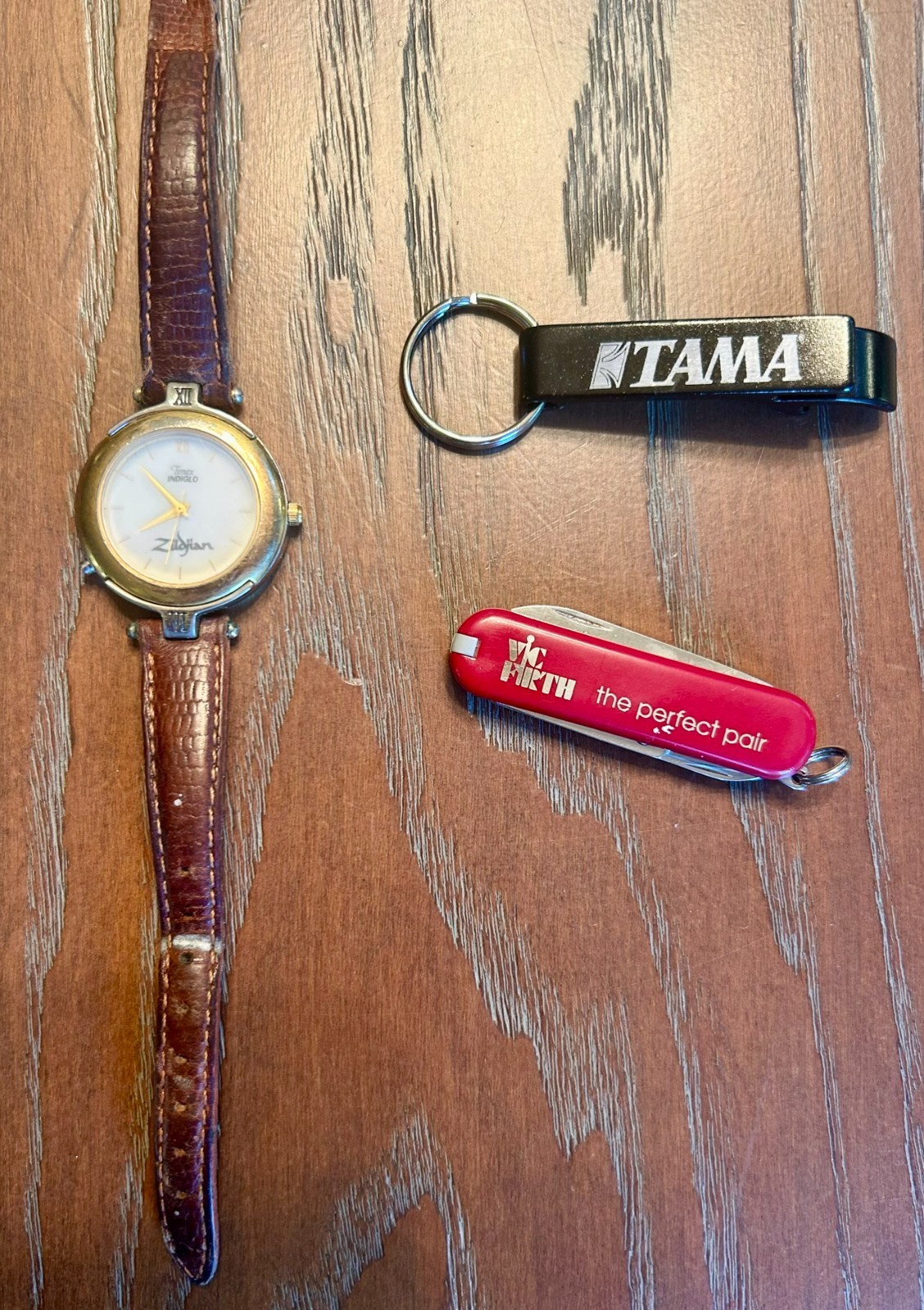 zildjian watch, vic firth swiss army knife and tama bottle opener package
