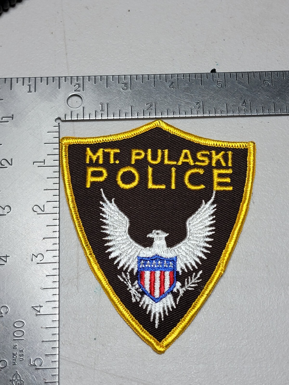 LE7 b3 Police patch patches Illinois Mt. Pulaski eagle brown background