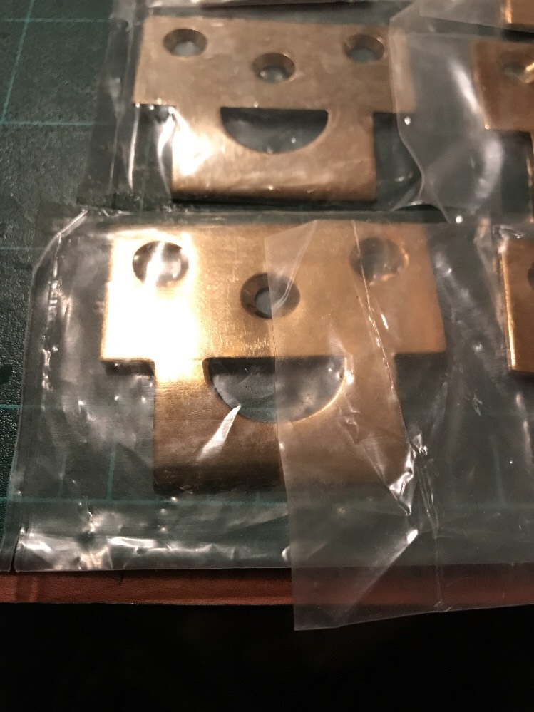 Deltana Surface Bolt Strike Plate Brass Polished. Curved Lip