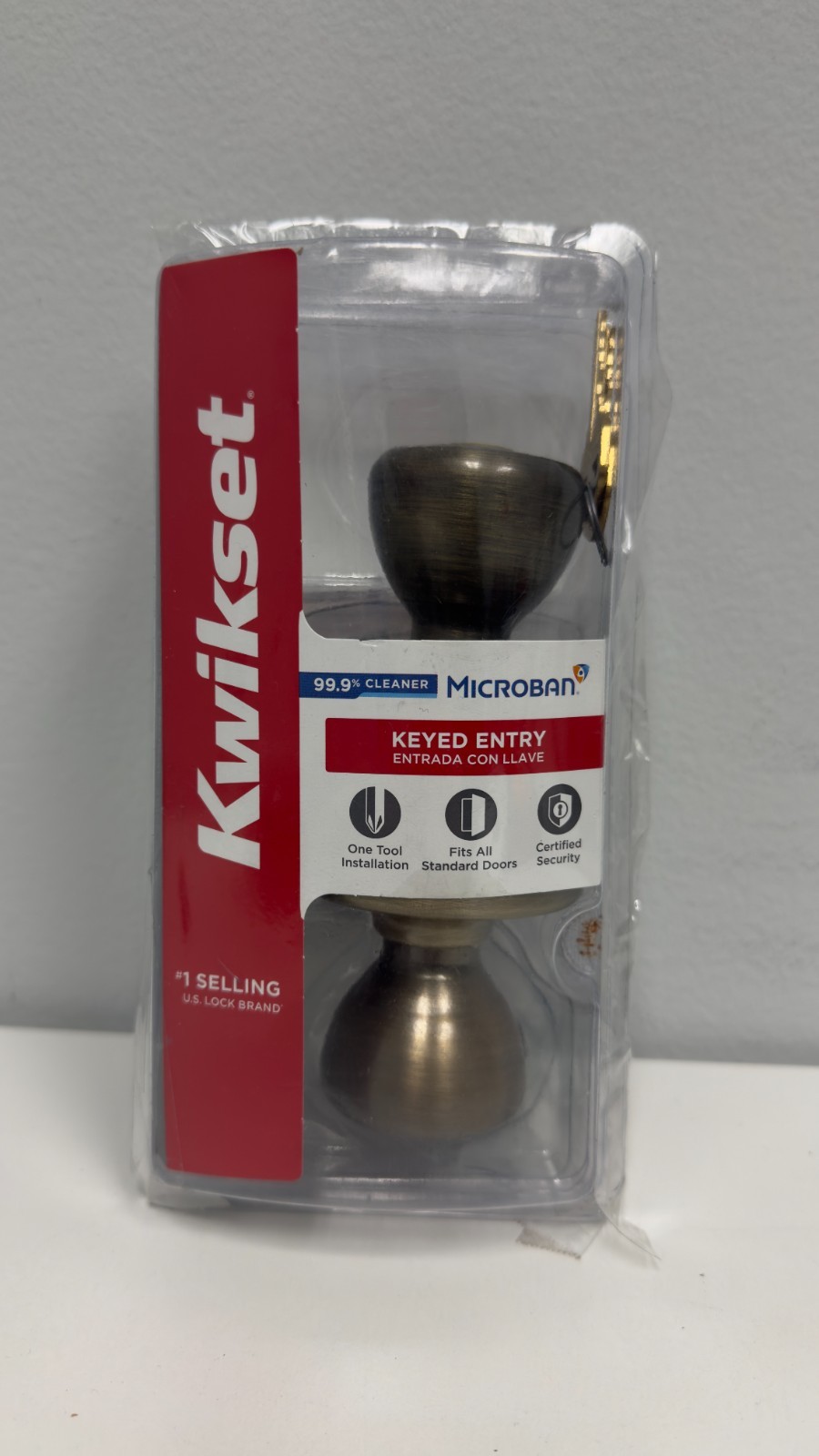 Kwikset Tylo Front Entry Door Knob 94002-827 Antique Brass