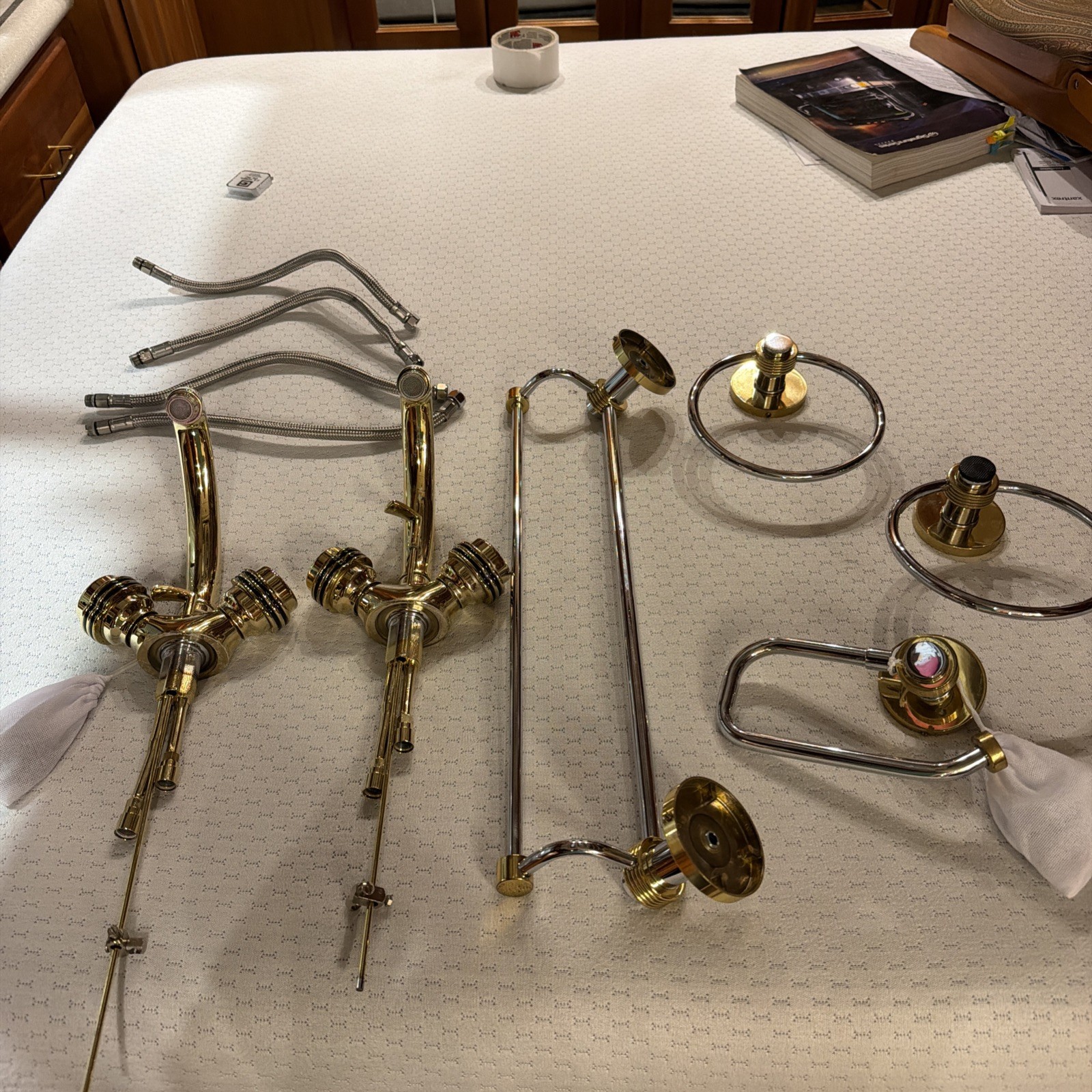 Polished Brass faucets with two types of towel and toilet paper holders