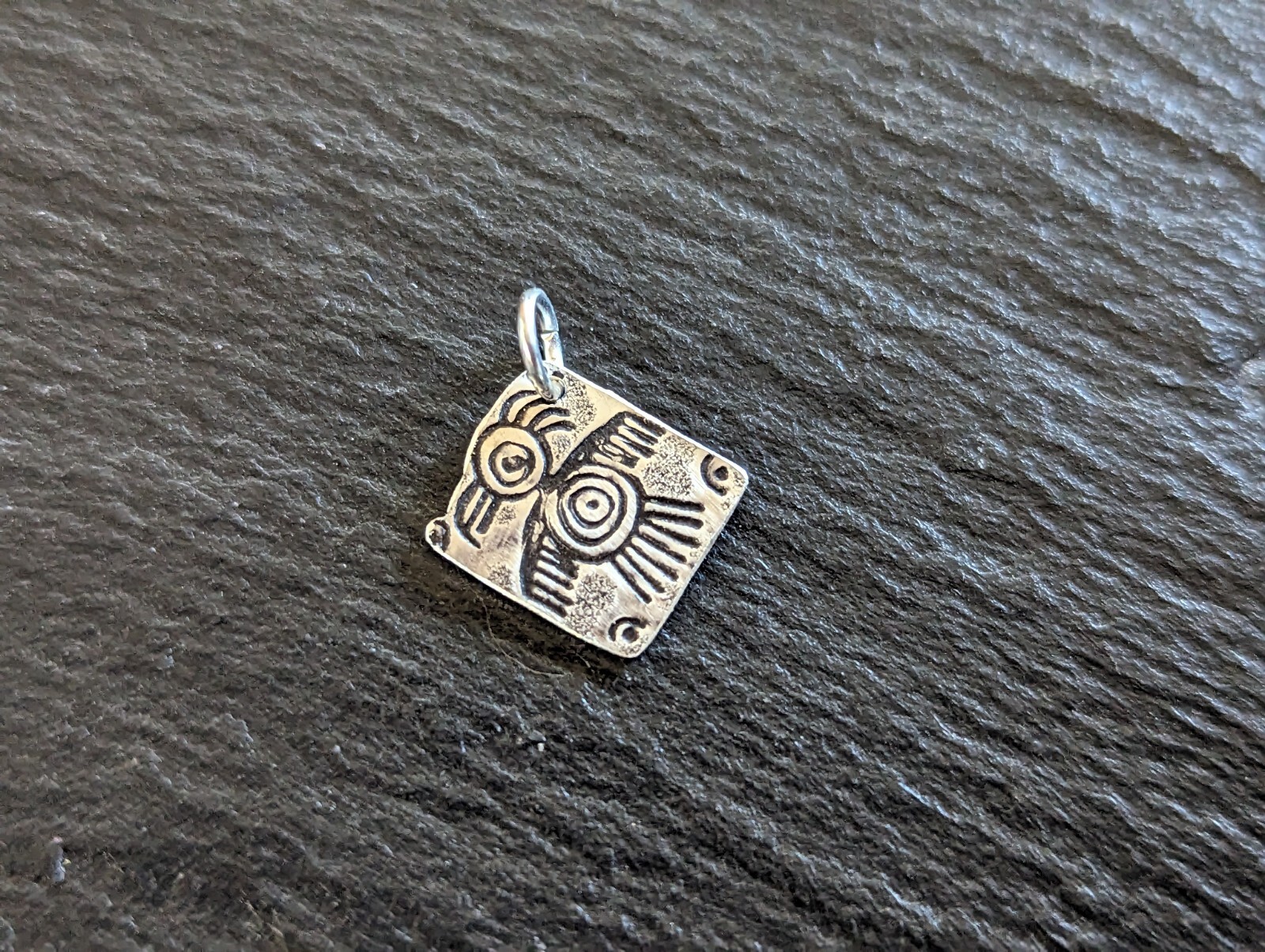 Tiny sterling silver charm with a bird sumbol - handmade - freeform