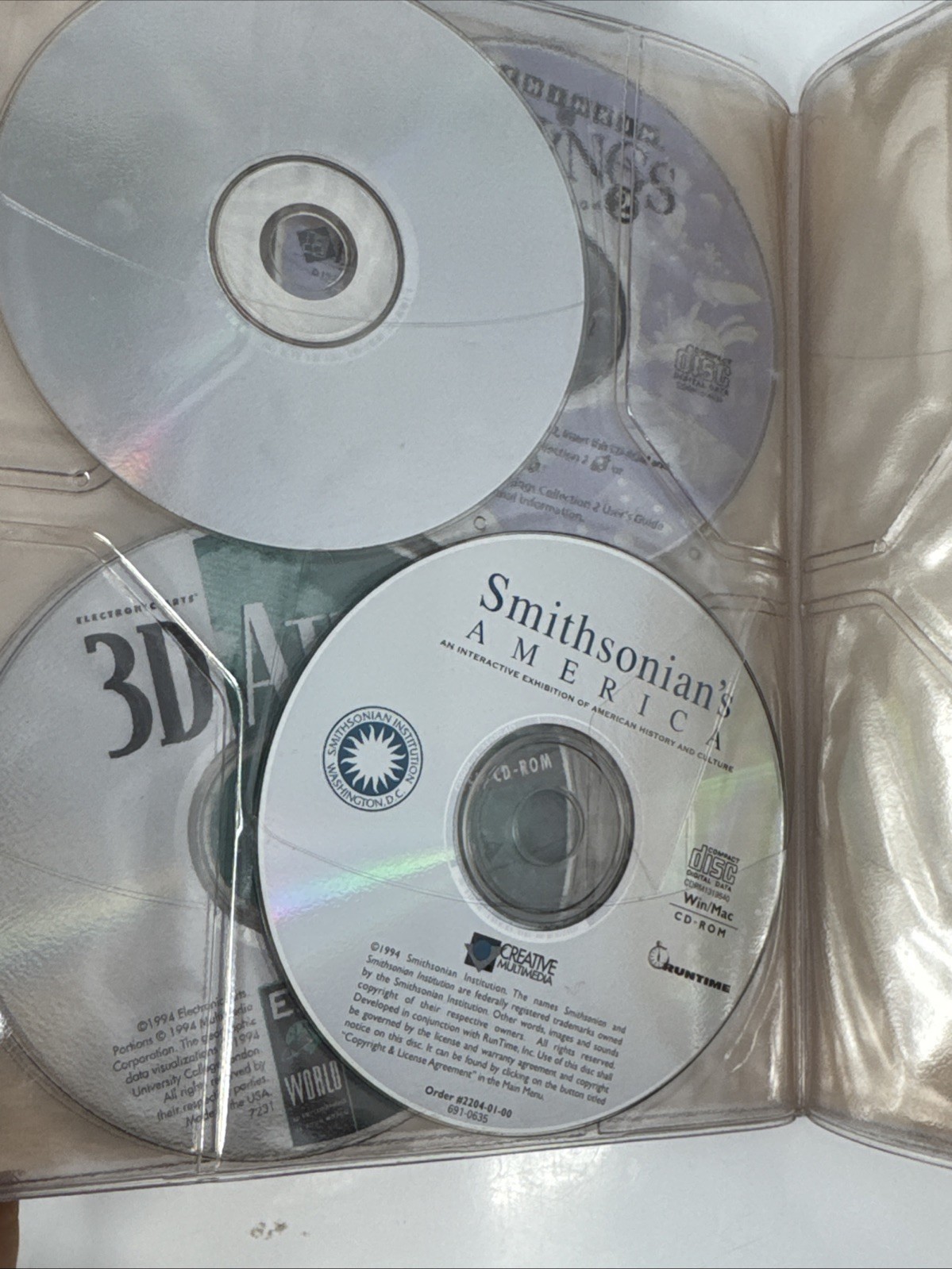 Vintage Macintosh 1990s CD-ROM Compact Discs Folder with 7 Discs