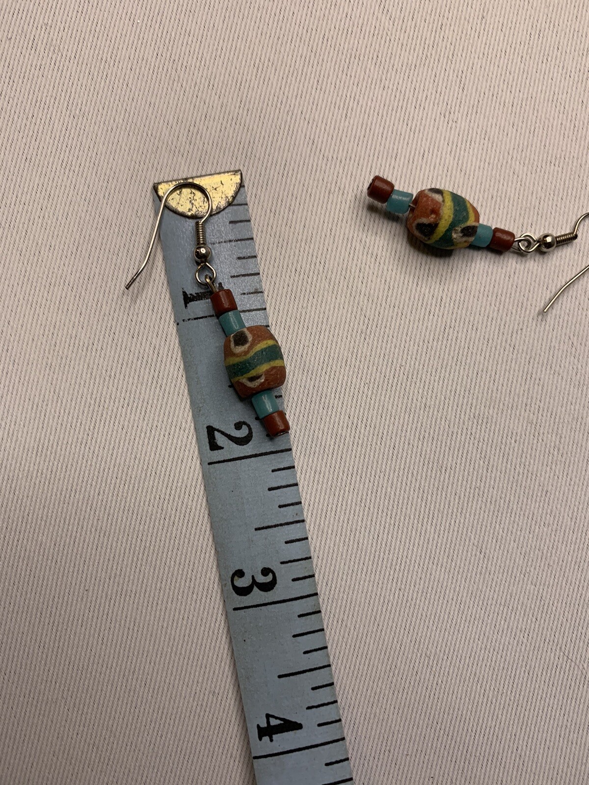 Silvertone and painted wood pierced earrings