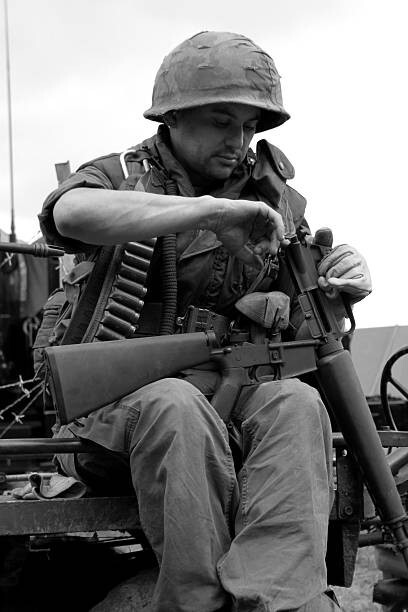 Vietnam  War  Photos --  US Soldier  - Cleaning His Gun