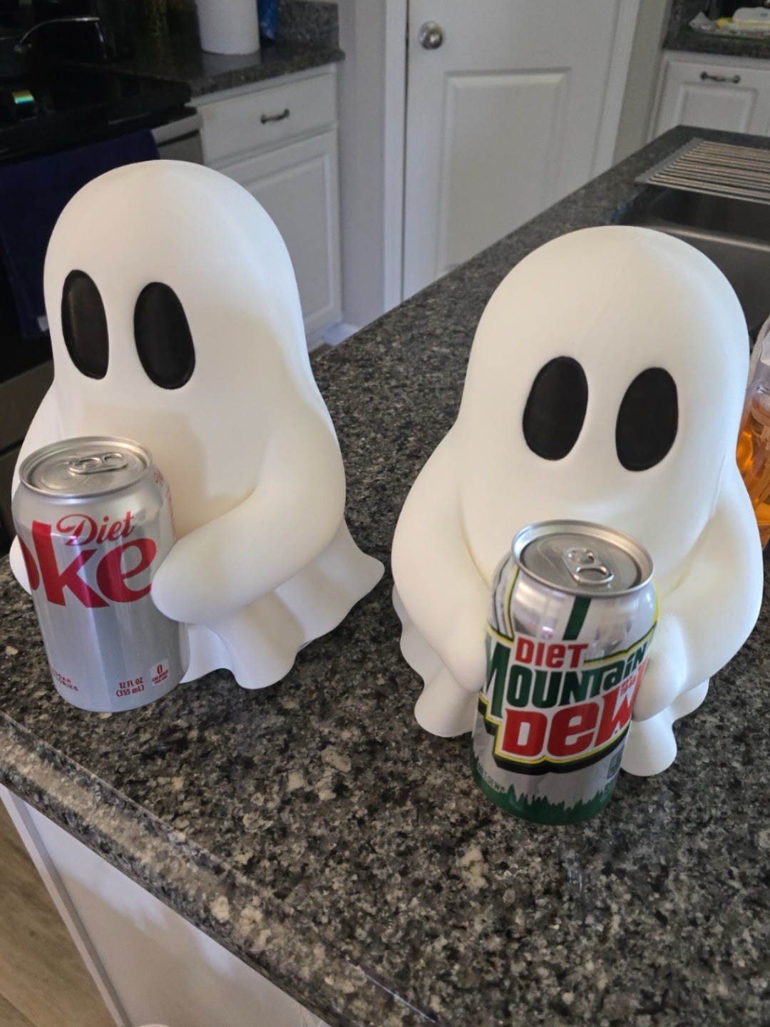 Ghosty holding soda can