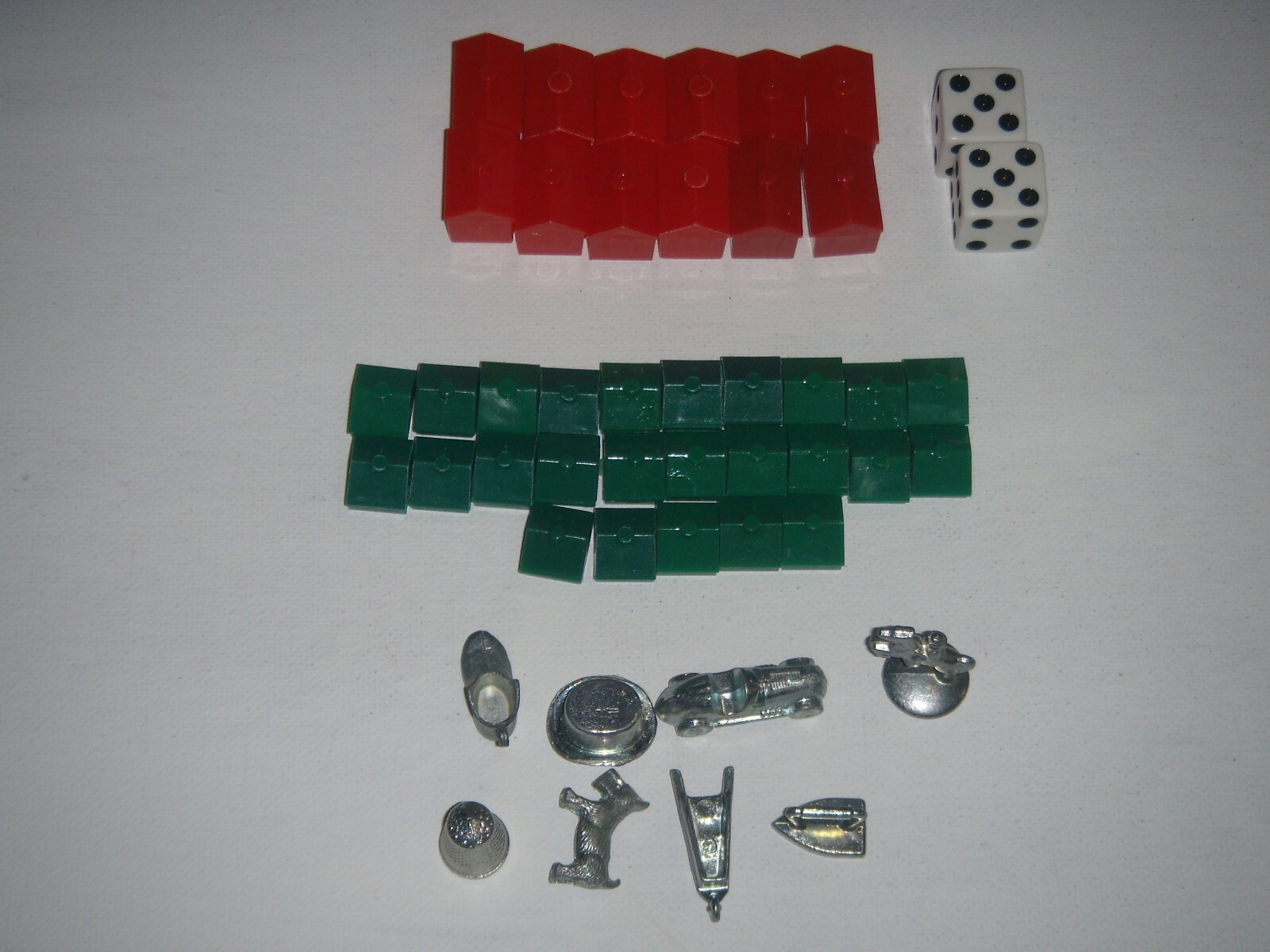 Monopoly Replacement Pieces. 25 Houses. 12 Hotels, 8 Game Pieces. 2 Dice.