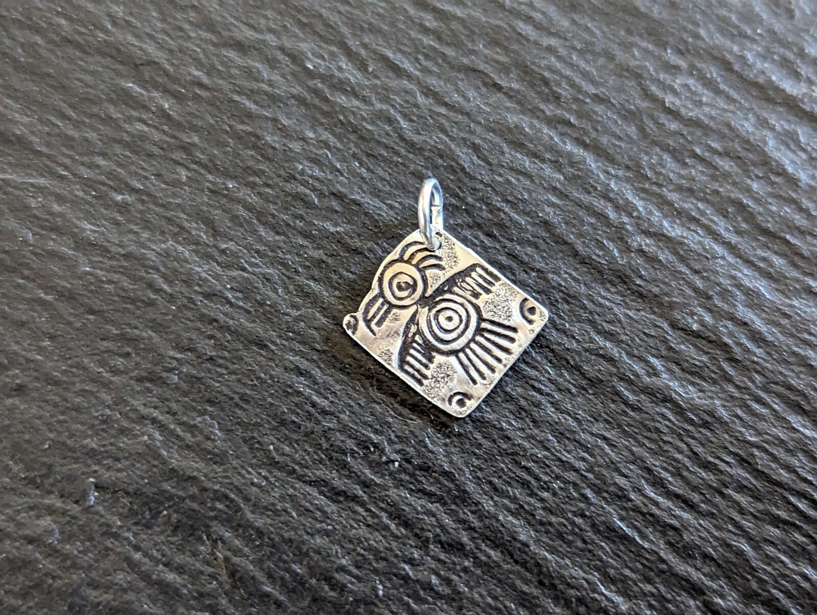 Tiny sterling silver charm with a bird sumbol - handmade - freeform