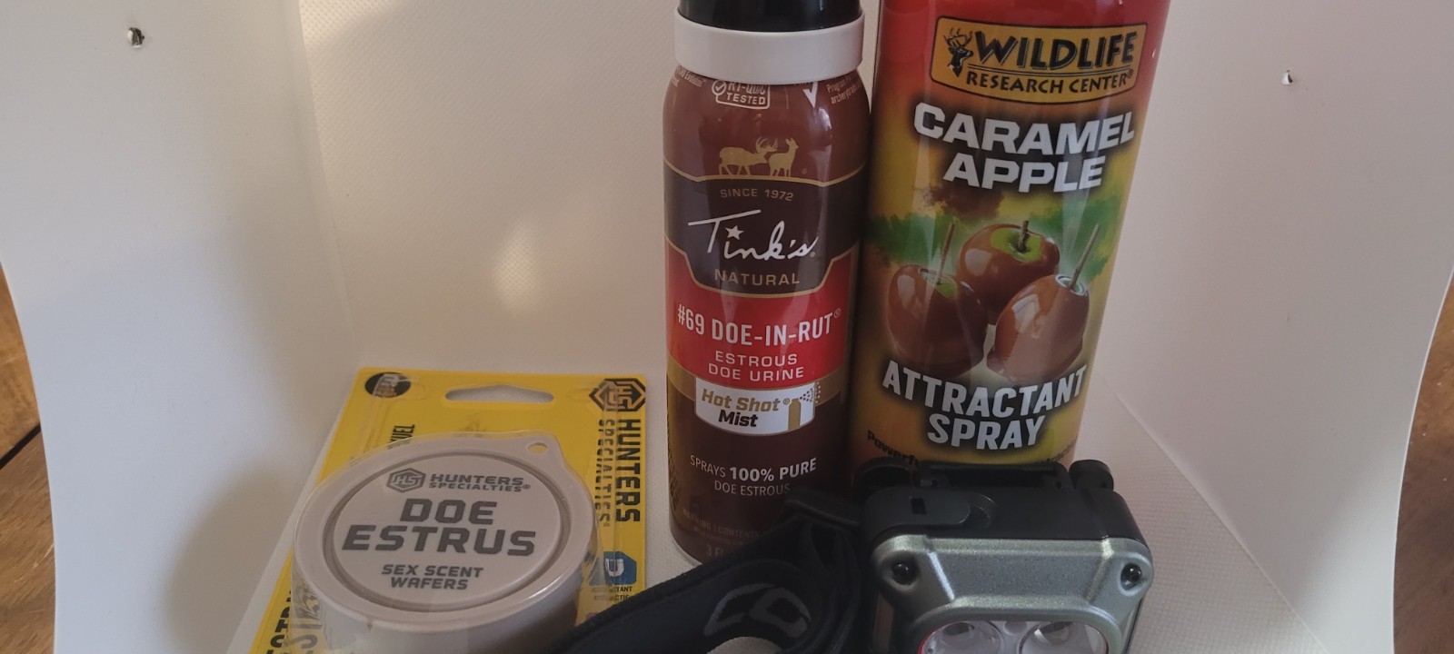 LOT OF"4"attractant caramel aple, 69 doe in rut,doe estrus, and coast head lamp