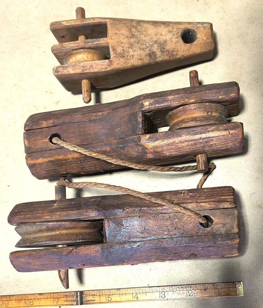 Antique wooden loom pulleys